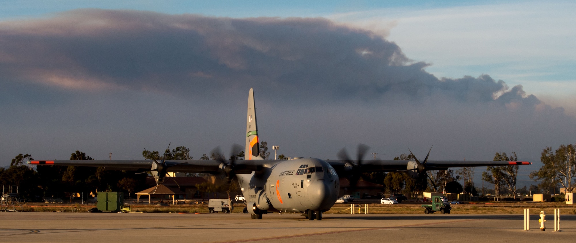 A C-130J of the 146th Airlift Wing, which carries the Modular Airborne Fire Fighting System (MAFFS), taxis for takeoff after being reloaded with flame retardant chemicals at Channel Islands Air National Guard Base in Port Hueneme, California, Dec. 9, 2017. (U.S. Air Force photo by J.M. Eddins Jr.)