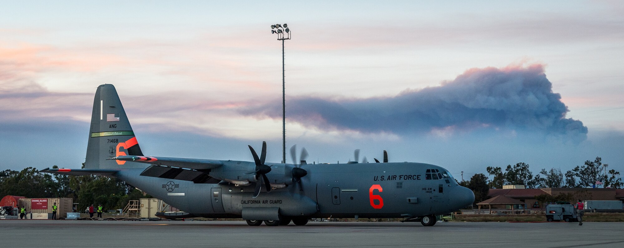 A C-130J of the 146th Airlift Wing, which carries the Modular Airborne Fire Fighting System (MAFFS), prepares to taxi for takeoff after being reloaded with flame retardant chemicals at Channel Islands Air National Guard Base in Port Hueneme, California, Dec. 9, 2017.(U.S. Air Force photo by J.M. Eddins Jr.)