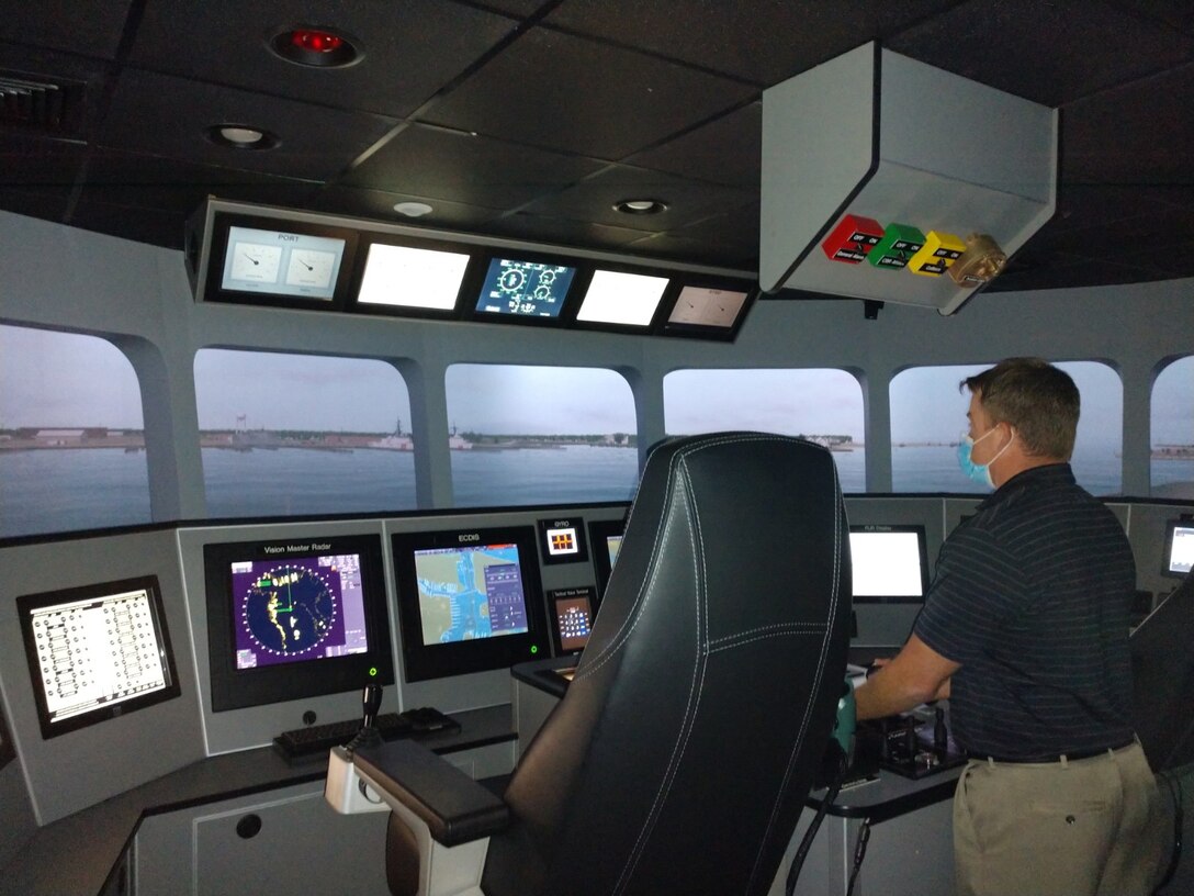 Eric Lehman, U.S. Army Transportation School Maritime & Intermodal Training Department instructor, operates the Expeditionary Fast Transport Simulator at Fort Eustis. The simulator is used to train mariners from the Military Sealift Command. EPF ships are high-speed, shallow draft ships capable of intra-theater personnel and cargo lift for the armed services. (Courtesy photo)