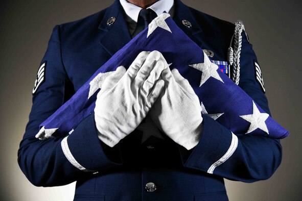 Staff Sgt. Olajide Shasanya, 22nd Force Support Squadron honor guardsman, holds a ceremonial flag May 25, 2021, at McConnell Air Force Base, Kansas. McConnell’s honor guard is responsible for covering events in 72 counties in Kansas and two counties in Oklahoma. (U.S. Air Force photo by Senior Airman Alexi Bosarge)