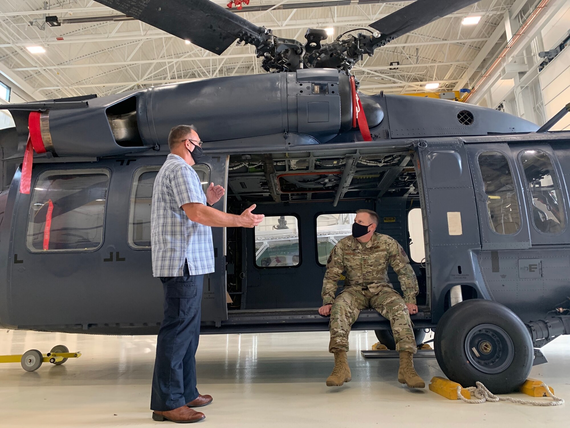 Chief Master Sgt. Michael Morgan sits in a helicopter at the IAAFA hangar May 10, 2021.