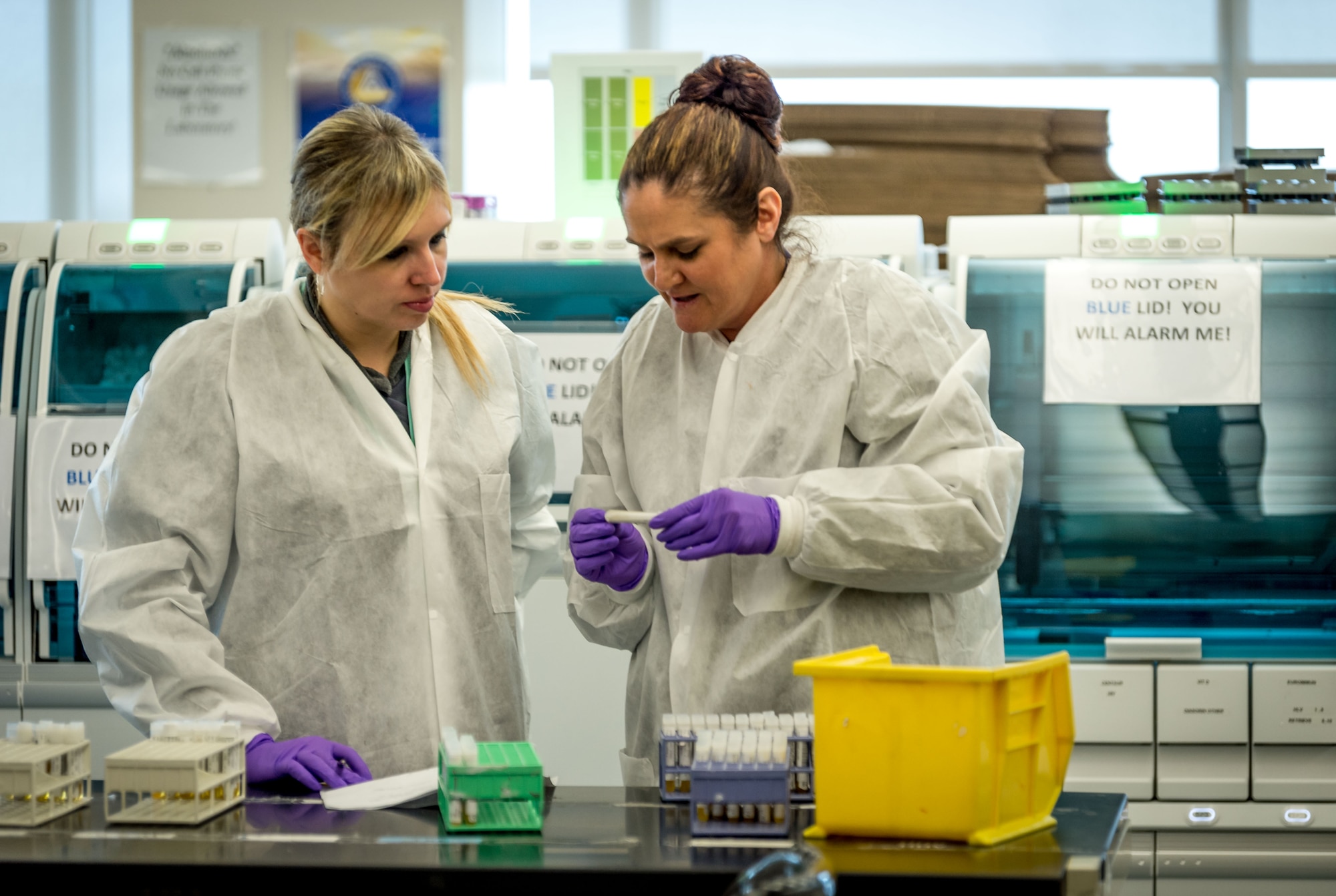 Lindsey White and Tiffany Miracle prepare serology samples to load into an automated analysis system in the immunodiagnostic section of the Epidemiology Laboratory Service, also known as the �Epi Lab,� at the 711th Human Performance Wing�s United States Air Force School of Aerospace Medicine and Public Health at Wright Patterson AFB, Ohio, Jan. 30, 2018. (U.S. Air Force photo by J.M. Eddins Jr.)