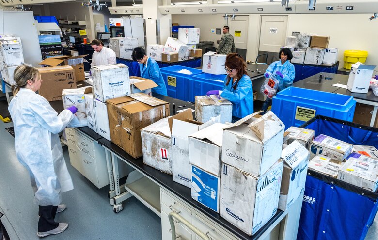 Laboratory technicians unpack and log in blood serum, fecal, urine or respiratory samples which arrive from U.S. Air Force hospitals and clinics around the world, as well as some other Department of Defense facilities Jan. 30, 2018. The Epidemiology Laboratory Service, also known as the �Epi Lab,� at the 711th Human Performance Wing�s United States Air Force School of Aerospace Medicine and Public Health at Wright Patterson AFB, Ohio, receives 100-150 boxes a day, six days a week. The lab, which tests between 5,000 and 8,000 samples daily, is a Department of Defense reference laboratory offering clinical diagnostic, public health, and force health screening and testing. (U.S. Air Force photo by J.M. Eddins Jr.)