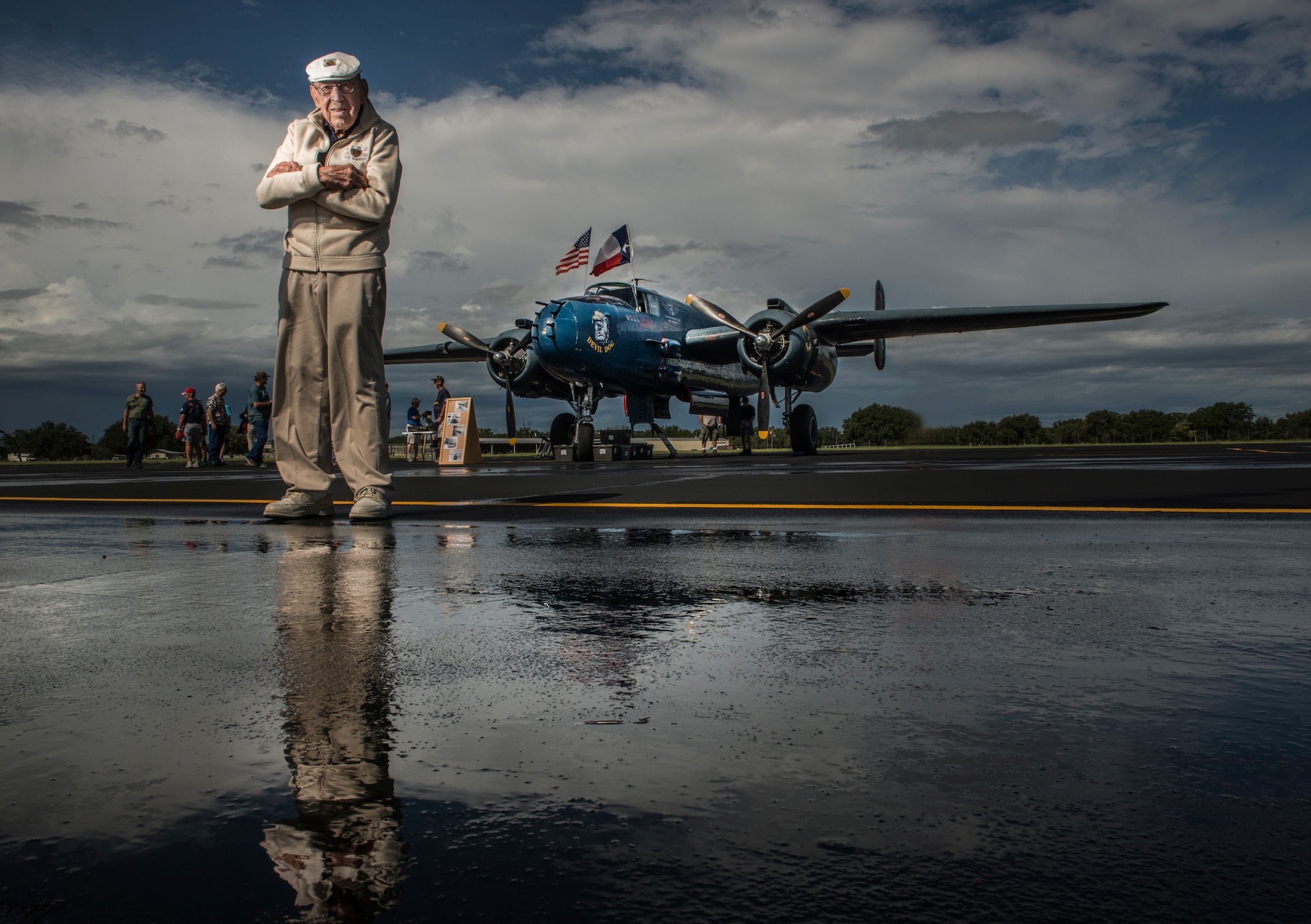 U.S. Air Force Retired Lt. Col. Richard E. Cole, Co-Pilot to Jimmy Doolittle during the Doolittle Raid, stands in front of a refurbished U.S. Navy B-25 Mitchell displayed at an airshow in Burnet, Texas. Lt. Col. Cole was honored by the community and guests as the only remaining military service member alive from the April 18, 1942 Doolittle Raid. (U.S. Air Force photo by Staff Sgt. Vernon Young Jr.)