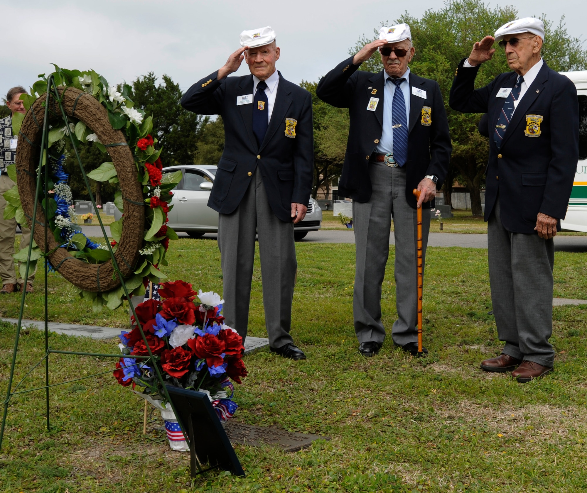 Form right, retired Lt. Col. Dick Cole, retired Lt. Col. Ed Saylor and retired Staff Sgt. David Thatcher salute their fallen brother, retired Master Sgt. Edwin Horton, April 18, 2013 in Fort Walton Beach, Fla. The men were all part of the Doolittle Raiders, who bombed Tokyo 71 years ago today. (U.S. Air Force Photo by Senior Airman Carlin Leslie)