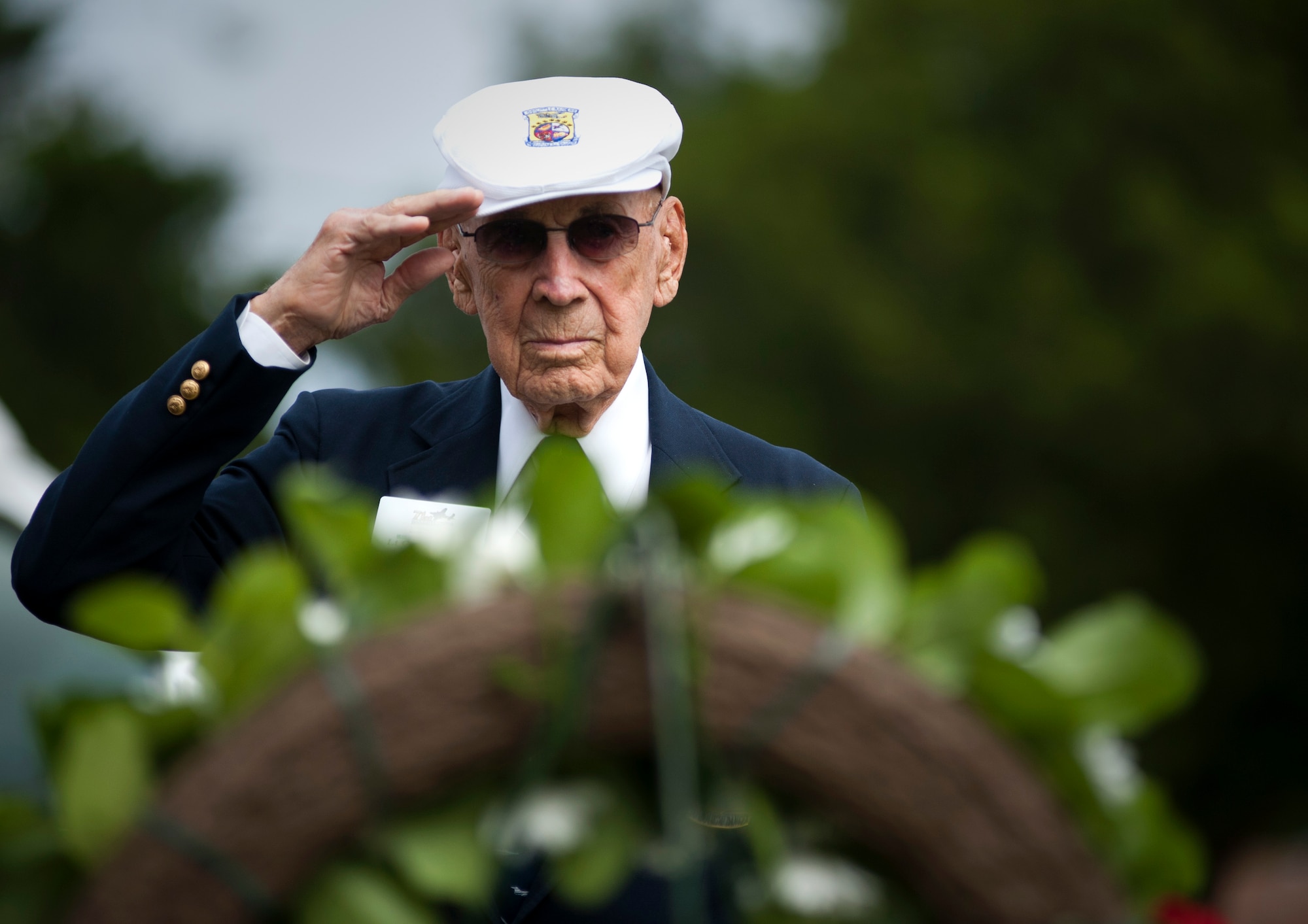 Retired Lt. Col. Dick Cole salutes the grave site of his fellow Doolittle Raider brother, retired Master Sgt. Edwin Horton, April 18, 2013, in Fort Walton Beach, Fla. (U.S. Air Force photo by Staff Sgt. David Salanitri)