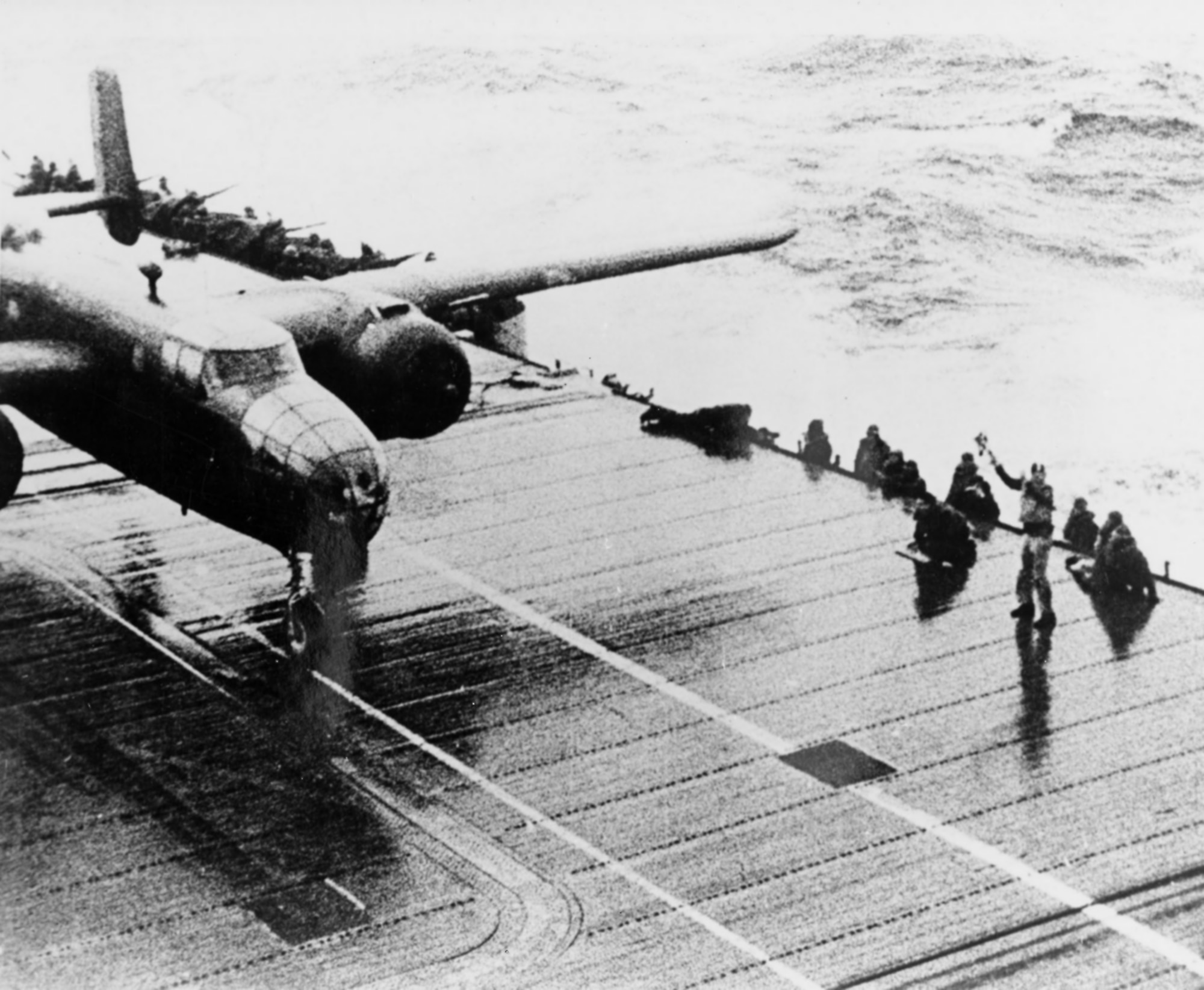 A B-25 begins its take off roll from the deck of the USS Hornet for the "Doolittle Raid" on Tokyo, Saturday, April 18, 1942. The bombing attack by the United States of America on the Japanese capital Tokyo and other places on the island of Honshu during World War II, was the first air raid to strike the Japanese Home Islands. Sixteen B-25B Mitchell medium bombers were launched without fighter escort from the U.S. Navy aircraft carrier USS Hornet deep in the Western Pacific Ocean, each with a crew of five men. The plan called for them to bomb military targets in Japan, and to continue westward to land in China�landing a medium bomber on Hornet was impossible.
