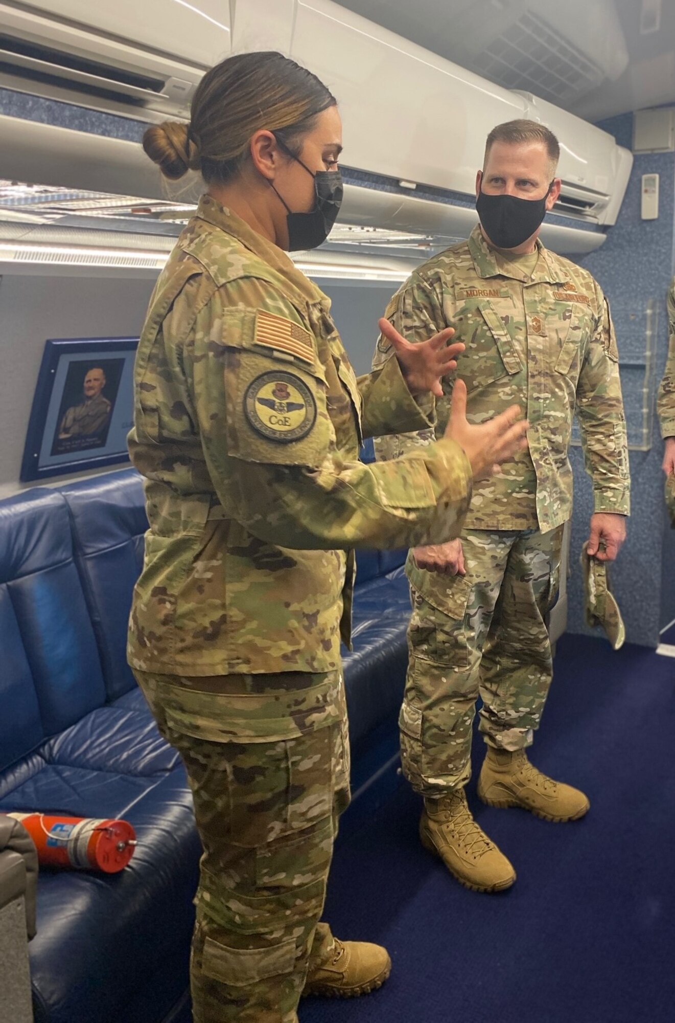 Tech. Sgt. Autumn Murphy tells Chief Morgan about the Speckled Trout aircraft.