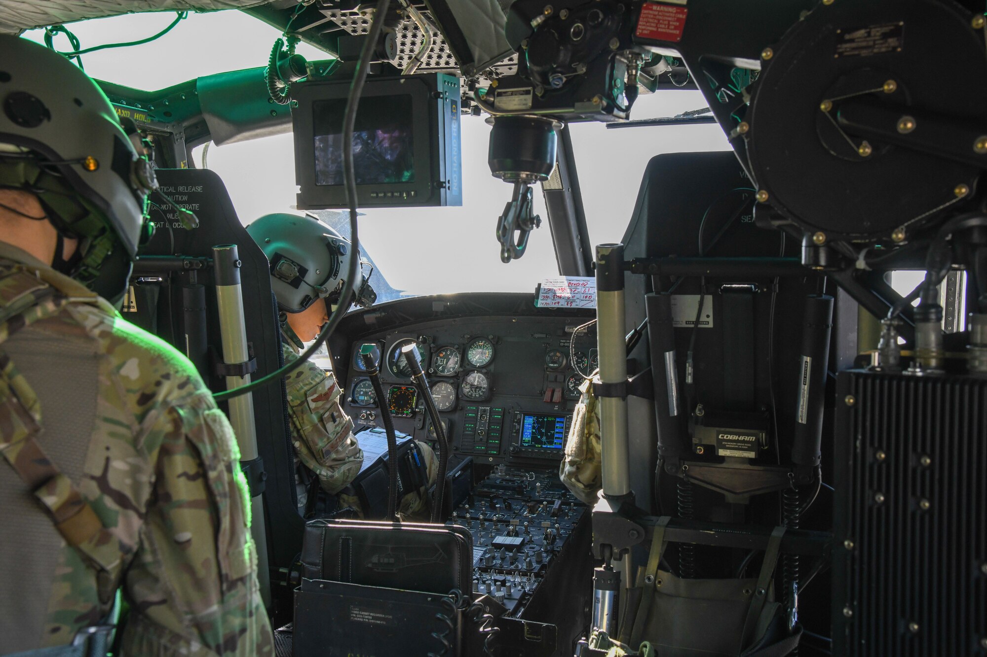view from inside of a cockpit of helicopter pilots