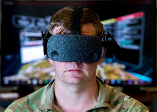 U.S. Air Force Master Sgt. Lee Bostson, 621st Contingency Response Group contingency location team lead, tests a new virtual reality system during Exercise Mobility Guardian 2021 at Alpena Combat Readiness Training Center, Alpena, Michigan, May 17, 2021. Mobility Guardian 2021 includes Air Mobility Command’s first large-scale training on Agile Combat Employment and Advanced Battle Management System through use of Tactical Data Link. (U.S. Air Force photo by Senior Airman Lawrence Sena)
