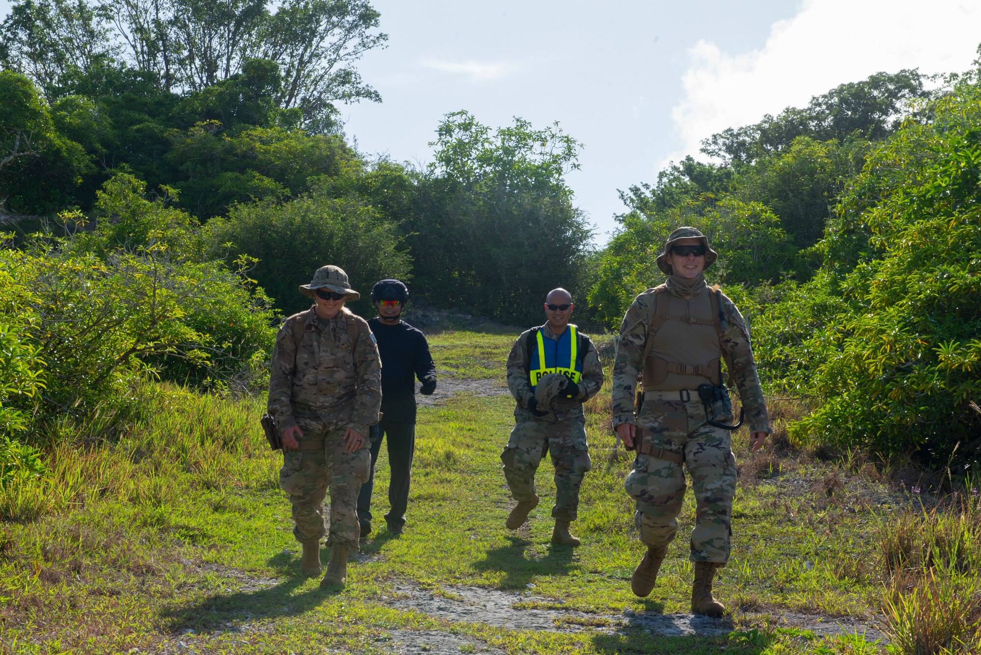 Tech. Sgt. Adam Rogers assigned to the 36th Security Forces Squadron performs a ground tasking operation overlooking a cliff face searching for signs of human activity along the eastern shoreline on Andersen Air Force Base, Guam May 14 2021. Andersen Air Force Base covers 14,600 acres, more than half of which is undeveloped land. (U.S. Air Force photo by SSgt Nicholas Crisp)