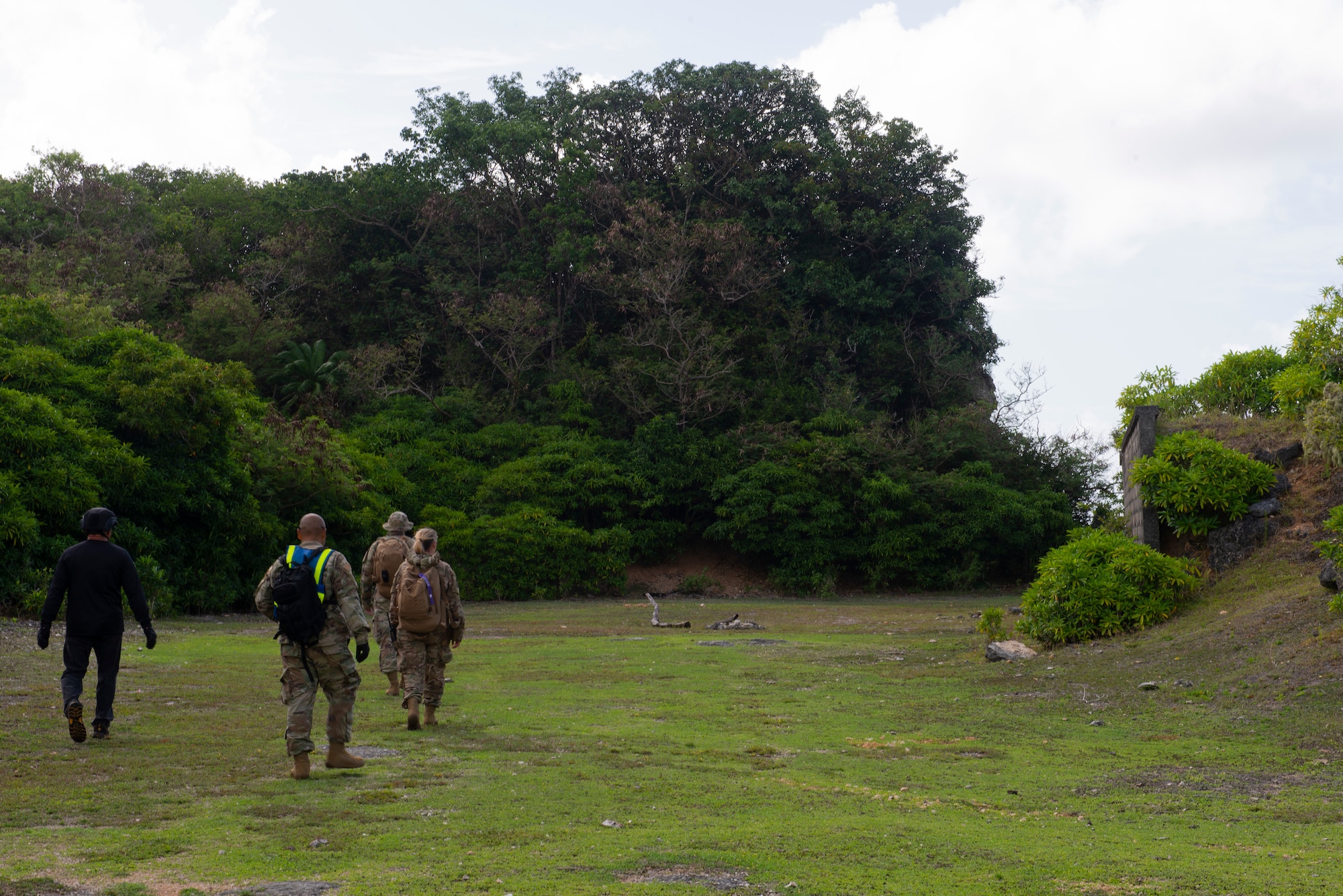 Tech. Sgt. Adam Rogers assigned to the 36th Security Forces Squadron performs a ground tasking operation overlooking a cliff face searching for signs of human activity along the eastern shoreline on Andersen Air Force Base, Guam May 14 2021. Andersen Air Force Base covers 14,600 acres, more than half of which is undeveloped land. (U.S. Air Force photo by SSgt Nicholas Crisp)