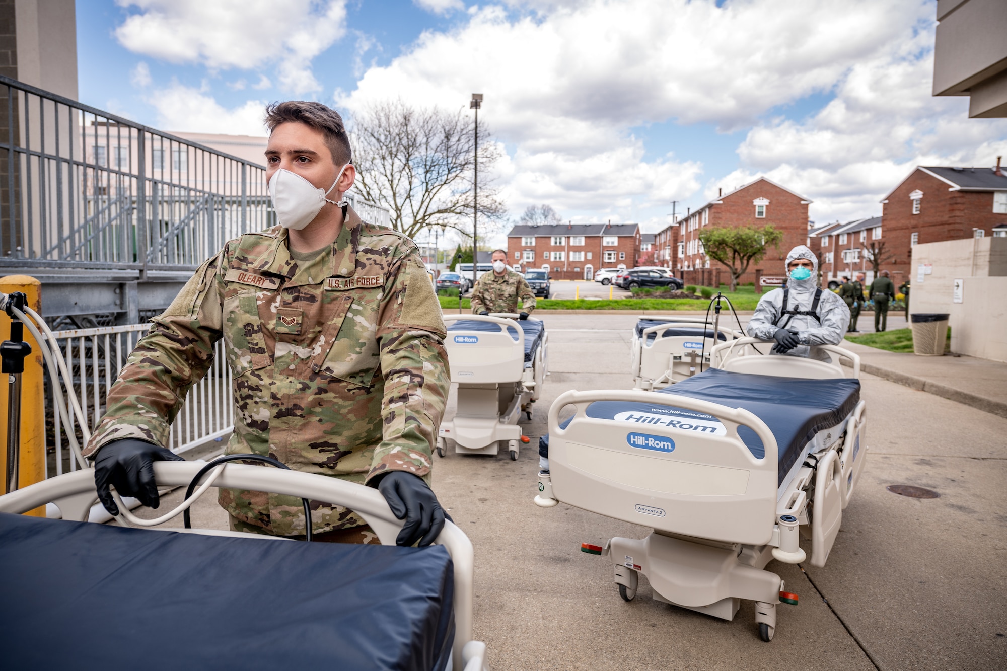 1Members of the West Virginia National Guard�s Task Force Chemical, Biological, Radiological and Nuclear (CBRN) Response Enterprise (CRE) (TF-CRE) and Task Force Sustainment (TF-Sustainment), assist staff of St. Francis Hospital, Charleston, West Virginia, to unload beds and additional medical equipment delivered to the hospital in an effort to build statewide medical surge capacity during on-going COVID-19 pandemic response, April 9, 2020. The equipment, resourced from Fairmont, West Virginia, was delivered by members of the West Virginia State Police, West Virginia Division of Highways, and West Virginia Division of Homeland Security and Emergency Management, as part of a whole of government partnership uniting local, state and federal agencies in coordinated response efforts. (U.S. Army National Guard photo by Edwin L. Wriston)