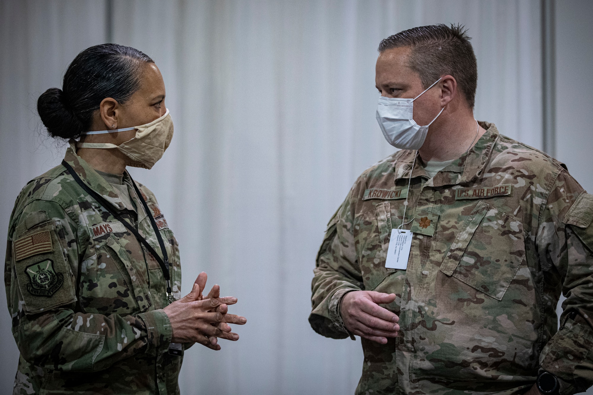 U.S. Air Force Col. Yvonne Mays, left, director of staff, New Jersey Air National Guard, speaks with Maj. Justin Krowicki, with the New Jersey Air National Guard’s 177th Fighter Wing, at the Federal Medical Station inside the Atlantic City Convention Center, Atlantic City, N.J., April 24, 2020. (U.S. Air National Guard photo by Master Sgt. Matt Hecht)