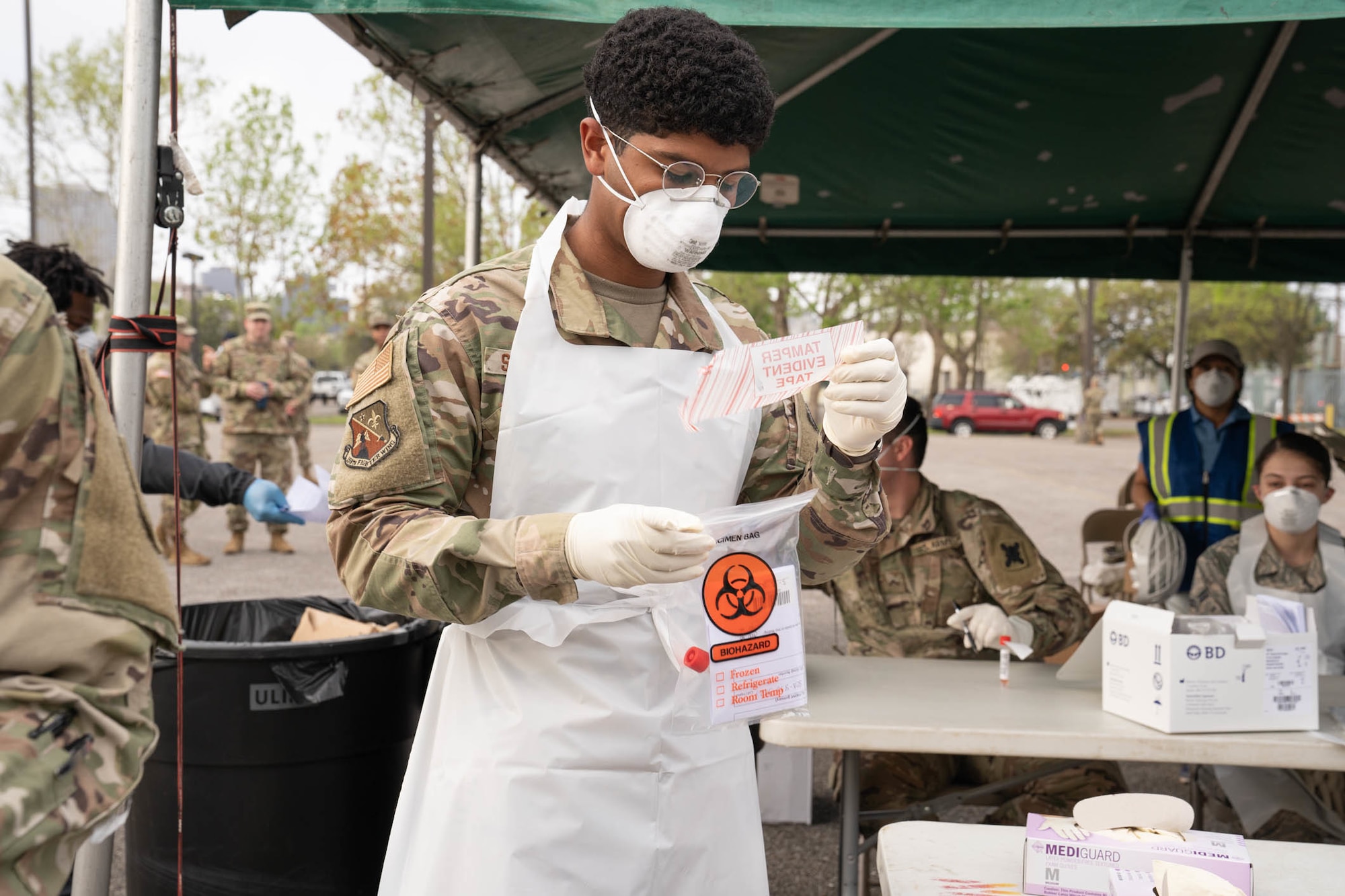 Louisiana National Guard Soldiers and Airmen test first responders for COVID-19 infections at Louis Armstrong Park, New Orleans, Louisiana, March 20, 2020. The testing site is one of three across New Orleans and Jefferson Parishes and will soon open to the general public. (U.S. Army National Guard photo by Staff Sgt. Josiah Pugh)