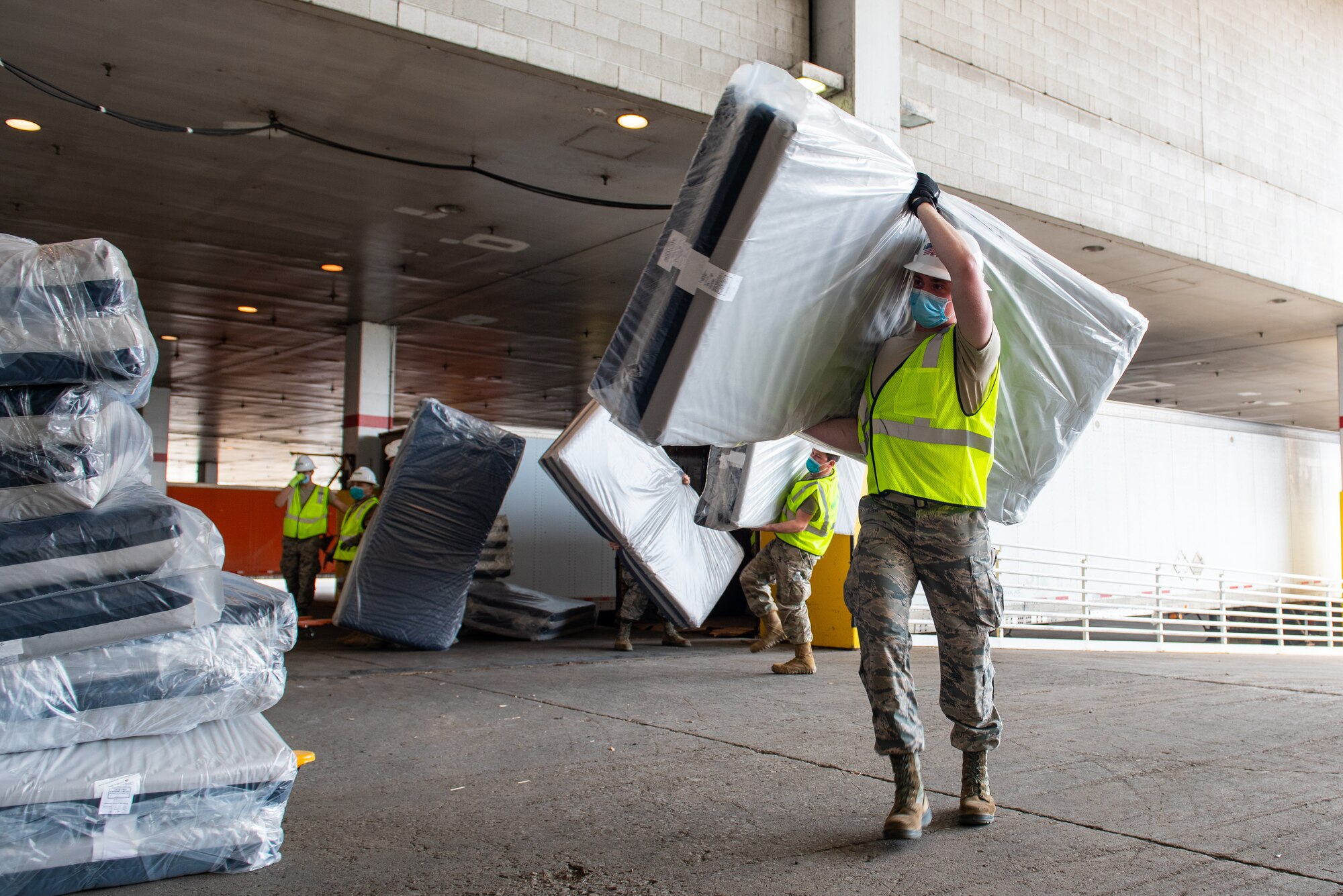 Members of the Illinois Air National Guard assemble medical equipment at the McCormick Place Convention Center in response to the COVID-19 pandemic in Chicago, Ill., April 8, 2020. Approximately 60 members of the Illinois Air National Guard were activated to support the US Army Corps of Engineers and the Federal Emergency Management Agency (FEMA) to temporarily convert part of the McCormick Place Convention Center into an Alternate Care Facility (ACF) for COVID-19 patients with mild symptoms who do not require intensive care in the Chicago area. (U.S. Air Force Photo by Senior Airman Jay Grabiec)