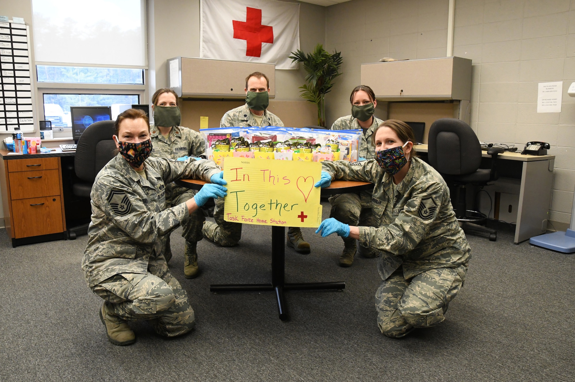 Members of the 104th Fighter Wing Medical Group and Public Health office prepare Easter treats for their wingmen, aerospace medical technicians serving at COVID-19 testing sites and helping backfill staff at facilities throughout Massachusetts. The home station team will deliver the treats for Airmen at their staging area to find as a surprise on Easter. Pictured from left to right: SMSgt Karla Belliveau, Maj. Barbara Jones, Lt. Col. Stephen Burgess, Master Sgt. Christine Lupacchino and Master Sgt. Kylie Burns-Whalen. (U.S. Air National Guard Photo by Senior Master Sgt. Julie Avey)