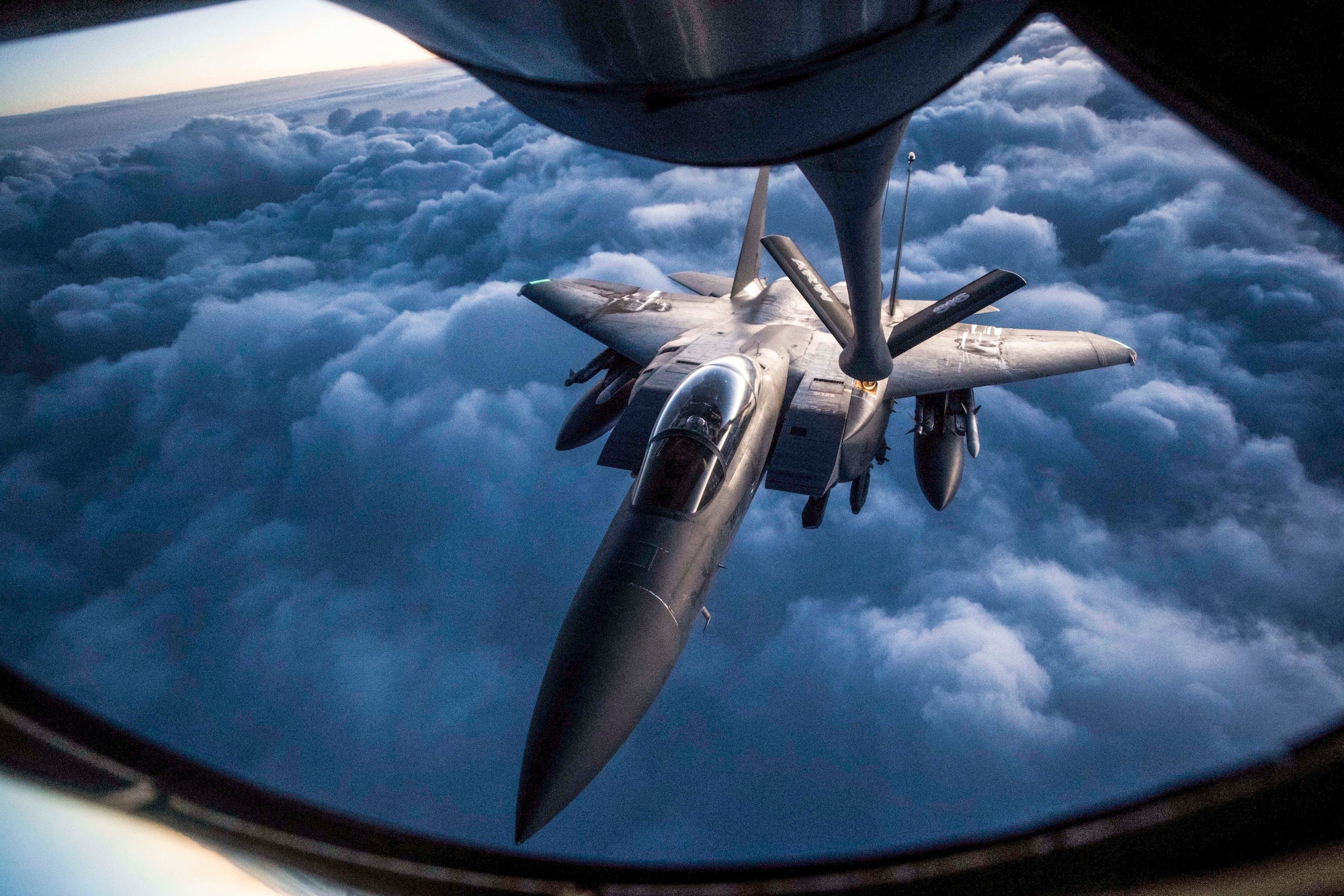 An F-15 Strike Eagle receives an aerial refueling from a KC-135 Stratotanker assigned to the 28th Expeditionary Air Refueling Squadron during a mission in support of Operation Inherent Resolve over Iraq, Sept. 12, 2018. The KC-135 provides aerial refueling to U.S. and coalition forces. The F-15 Eagle is an all-weather, extremely maneuverable, tactical fighter designed to permit the Air Force to gain and maintain air supremacy over the battlefield. (U.S. Air Force photo by Staff Sgt. Keith James)