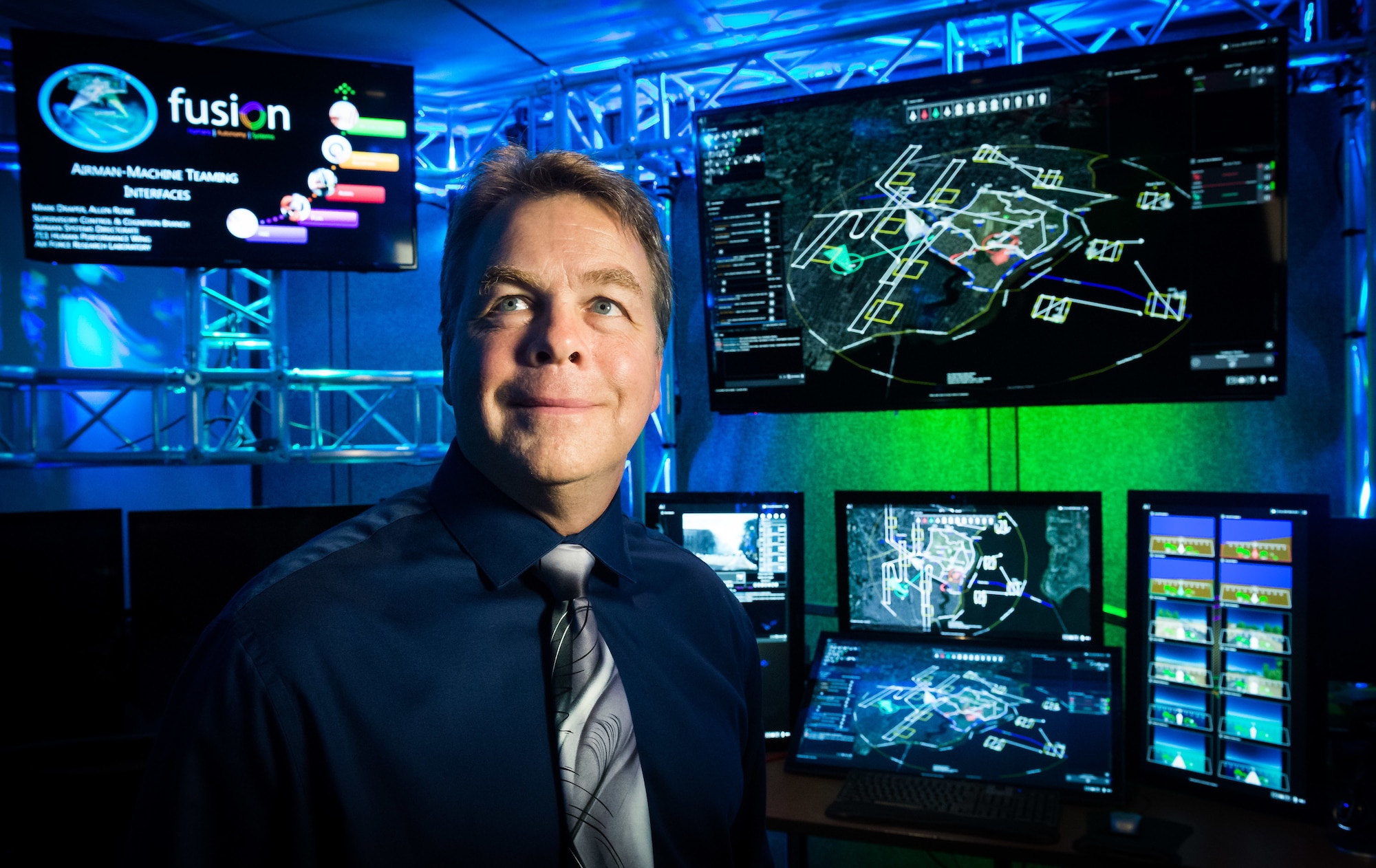 Dr. Mark Draper, a principal engineering research psychologist with the 711th Human Performance Wing at the Air Force Research Laboratory at Wright Patterson Air Force Base in Dayton, Ohio, stands in the Human Autonomy Lab where research focuses on how to better interconnect human intelligence with machine intelligence. (U.S. Air Force photo by J.M. Eddins Jr.)