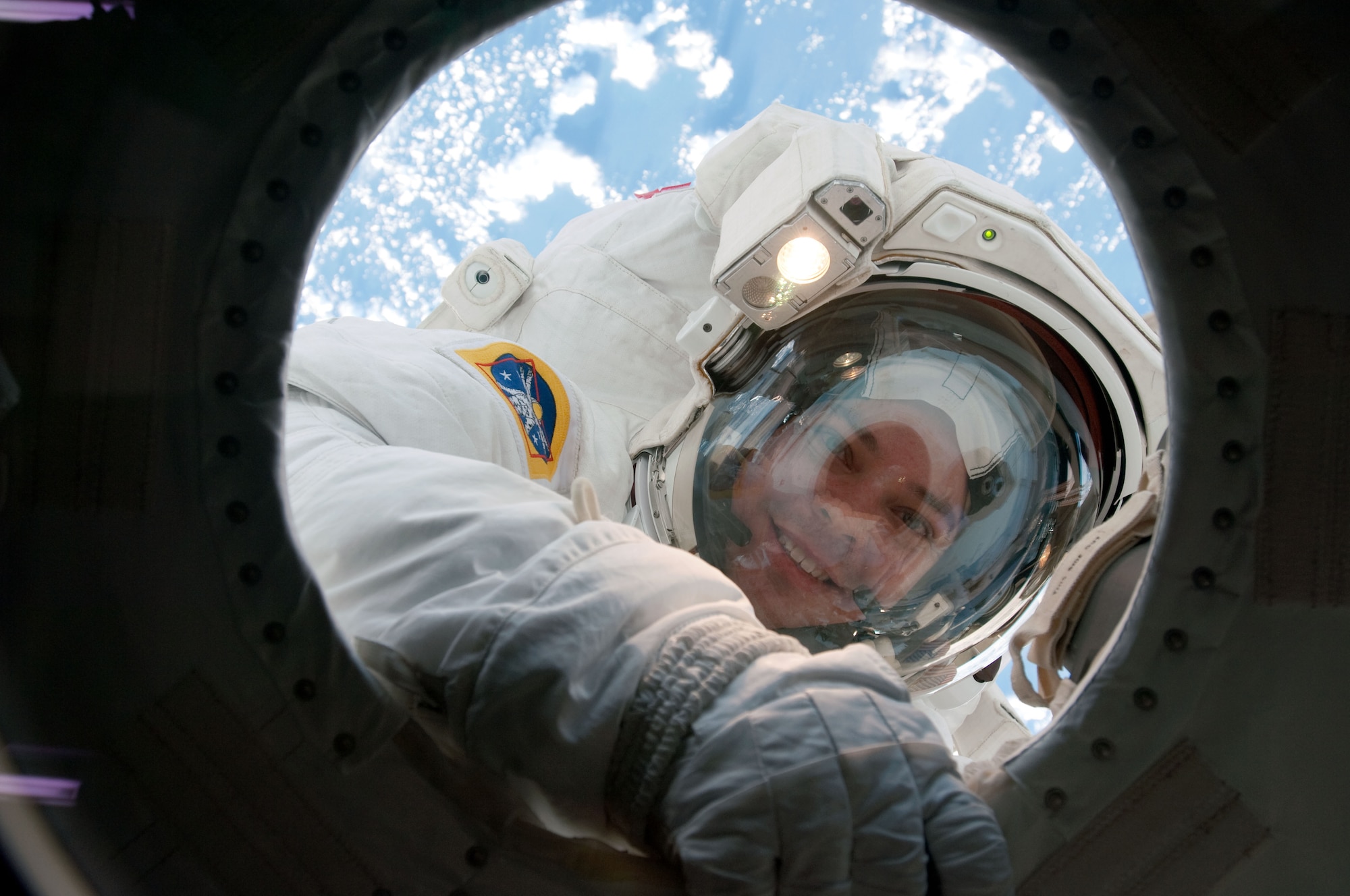 NASA astronaut Robert Behnken, STS-130 mission specialist, takes a break in the mission's second session of extravehicular activity (EVA) for construction and maintenance on the International Space Station in February of 2010 to allow air scrubbers to remove CO2 that had built up in his space suit. During the five-hour, 54-minute spacewalk, Behnken and astronaut Nicholas Patrick connected two ammonia coolant loops, installed thermal covers around the ammonia hoses, outfitted the Earth-facing port on the Tranquility node for the relocation of its Cupola, and installed handrails and a vent valve on the new module. (Photo/NASA)