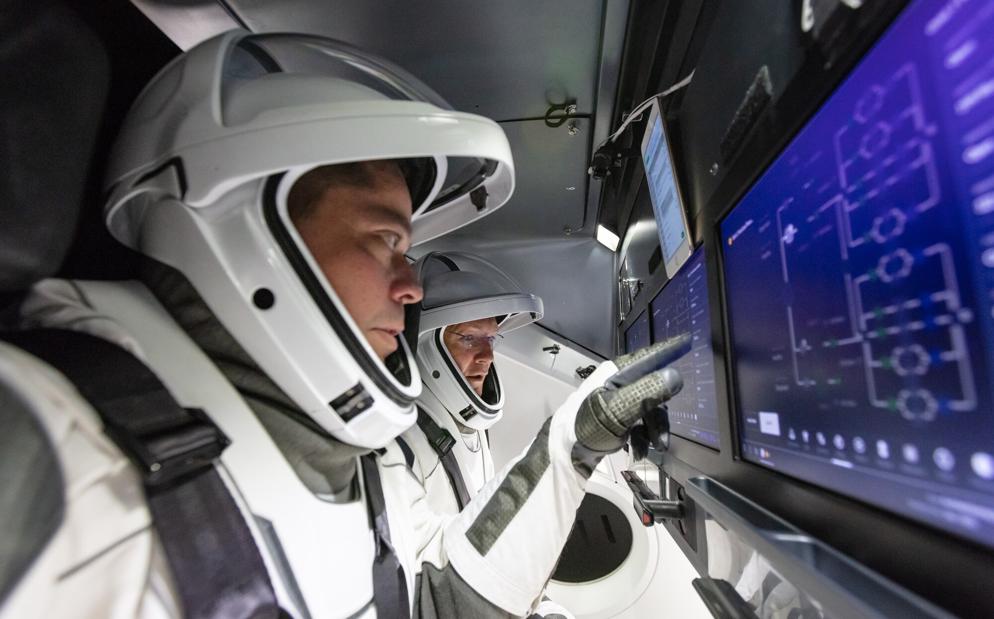 NASA astronauts Doug Hurley and Bob Behnken familiarize themselves with SpaceX’s Crew Dragon, the spacecraft that will transport them to the International Space Station as part of NASA’s Commercial Crew Program. Their upcoming flight test is known as Demo-2, short for Demonstration Mission 2. The Crew Dragon will launch on SpaceX’s Falcon 9 rocket from Launch Complex 39A at NASA’s Kennedy Space Center in Florida. In March 2019, SpaceX completed an uncrewed flight test of Crew Dragon known as Demo-1, which was designed to validate end-to-end systems and capabilities, bringing NASA closer to certification of SpaceX systems to fly a crew.