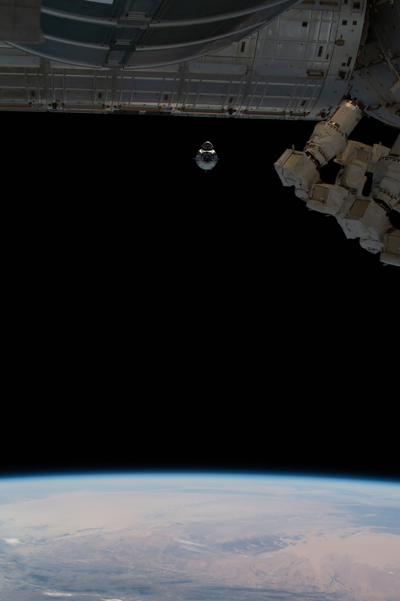 SpaceX’s Crew Dragon approaches the International Space Station during the Demo-1 mission on Sunday, March 3, 2019. The uncrewed spacecraft docked to the orbiting laboratory following a 2:49 a.m. EST liftoff aboard a SpaceX Falcon 9 rocket from Launch Complex 39A at NASA’s Kennedy Space Center in Florida on March 2. Crew Dragon made 18 orbits of Earth before successfully attaching to the space station. The spacecraft undocked at 2:32 a.m., March 8, splashing down in the Atlantic Ocean, about 200 miles off Florida’s east coast, at 8:45 a.m. It arrived in Port Canaveral in Florida on the main deck of SpaceX’s recovery ship, Go Searcher, on March 9. SpaceX’s inaugural flight with NASA’s Commercial Crew Program is the first flight test of a space system designed for humans built and operated by a commercial company through a public-private partnership. NASA and SpaceX will use data from Demo-1 to further prepare for Demo-2, the crewed flight test that will carry NASA astronauts Bob Behnken and Doug Hurley to the International Space Station later this year.