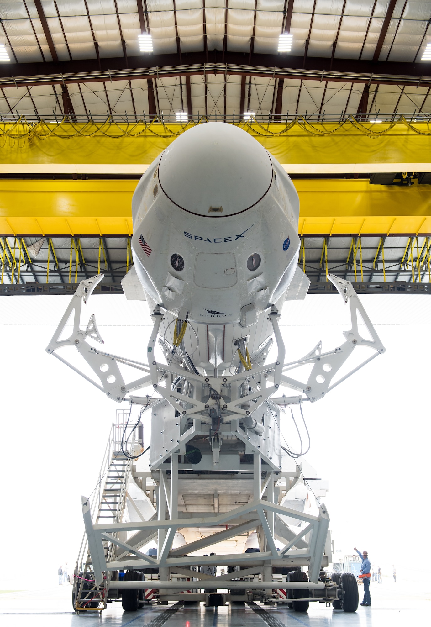 A SpaceX Falcon 9 rocket with the company's Crew Dragon spacecraft onboard is seen as it is rolled out of the horizontal integration facility at Launch Complex 39A as preparations continue for the Demo-1 mission, Feb. 28, 2019 at the Kennedy Space Center in Florida. The Demo-1 mission will be the first launch of a commercially built and operated American spacecraft and space system designed for humans as part of NASA's Commercial Crew Program. The mission, currently targeted for a 2:49am launch on March 2, will serve as an end-to-end test of the system's capabilities Photo Credit: (NASA/Joel Kowsky)