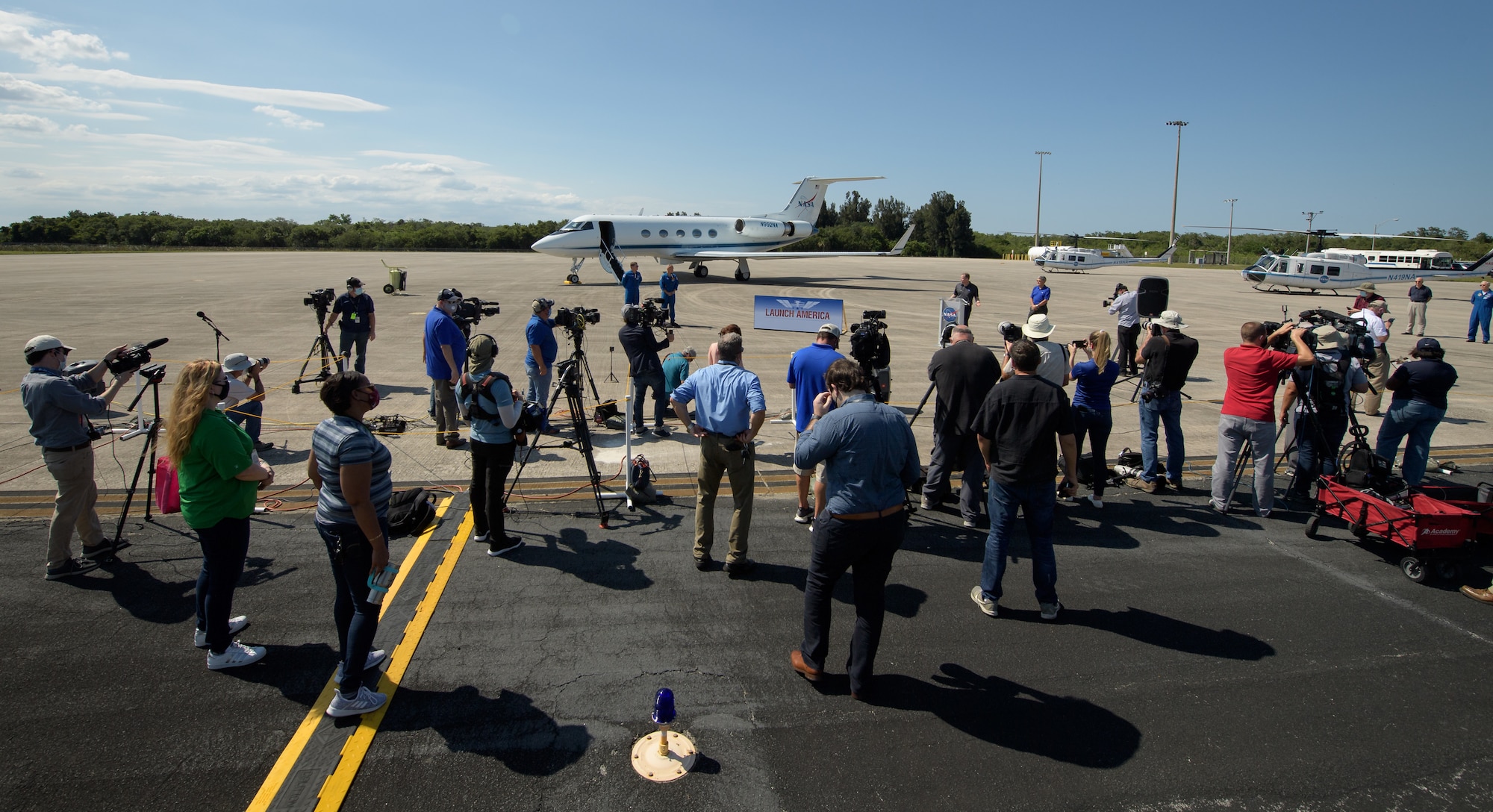 NASA Administrator Jim Bridenstine and Kennedy Space Center Director Bob Cabana greet NASA astronauts Robert Behnken, left, and Douglas Hurley as they arrive at the Launch and Landing Facility at NASA’s Kennedy Space Center ahead of SpaceX’s Demo-2 mission, Wednesday, May 20, 2020, in Florida. NASA’s SpaceX Demo-2 mission is the first launch with astronauts of the SpaceX Crew Dragon spacecraft and Falcon 9 rocket to the International Space Station as part of the agency’s Commercial Crew Program. The flight test will serve as an end-to-end demonstration of SpaceX’s crew transportation system. Behnken and Hurley are scheduled to launch at 4:33 p.m. EDT on Wednesday, May 27, from Launch Complex 39A at the Kennedy Space Center. A new era of human spaceflight is set to begin as American astronauts once again launch on an American rocket from American soil to low-Earth orbit for the first time since the conclusion of the Space Shuttle Program in 2011.  Photo Credit: (NASA/Bill Ingalls)