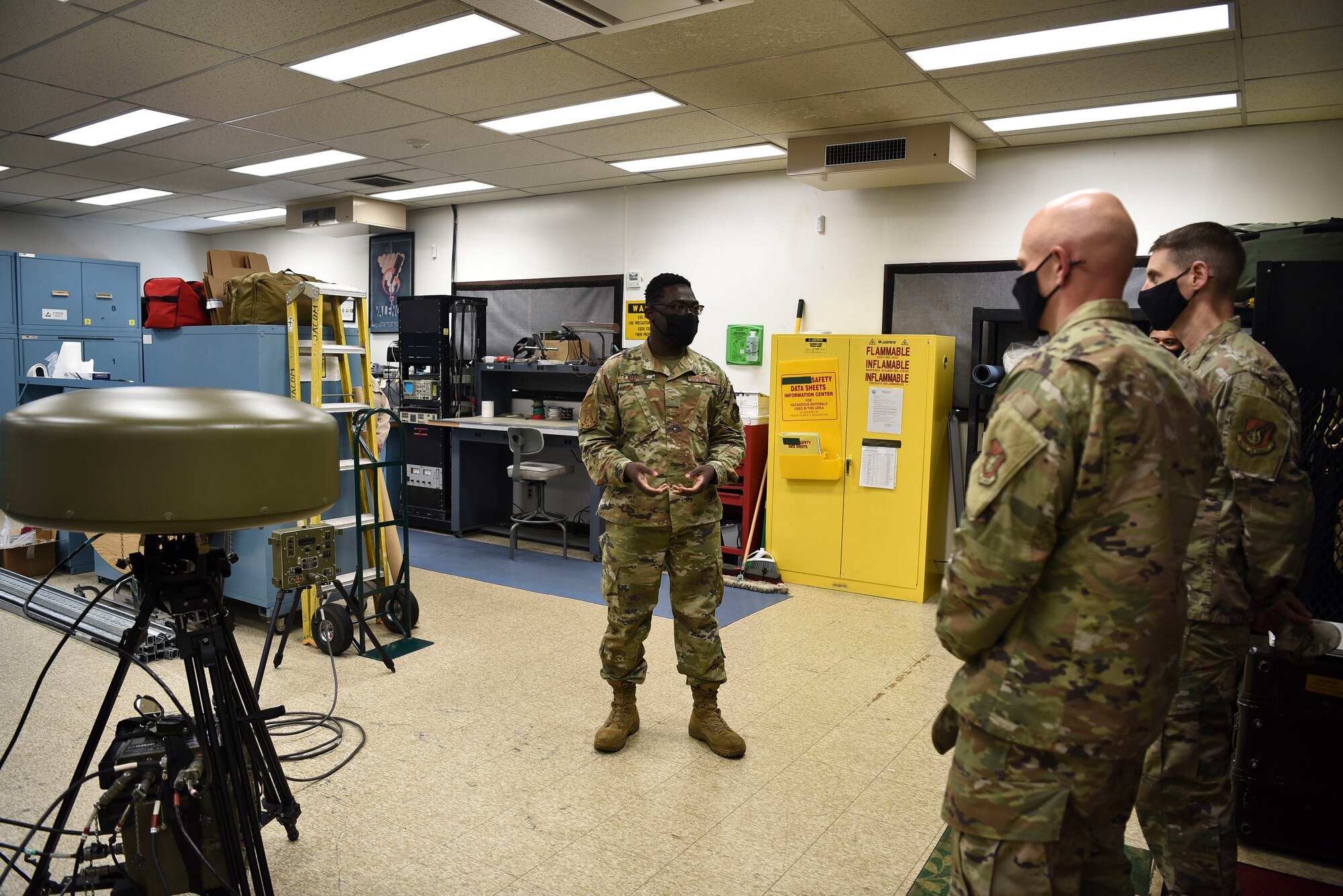 U.S. Air Force Airman 1st Class Simisola Mark, 35th Operations Support Squadron radar airfield weather system technician, explains the TRN-41 mobile Tactical Air Navigation (TACAN) to Col. Timothy Murphy, 35th Fighter Wing vice commander, and Chief Master Sgt. Joey Meininger, 35th Fighter Wing command chief, during a Wild Weasel Walk-Through at Misawa Air Base, Japan, May 24, 2021.