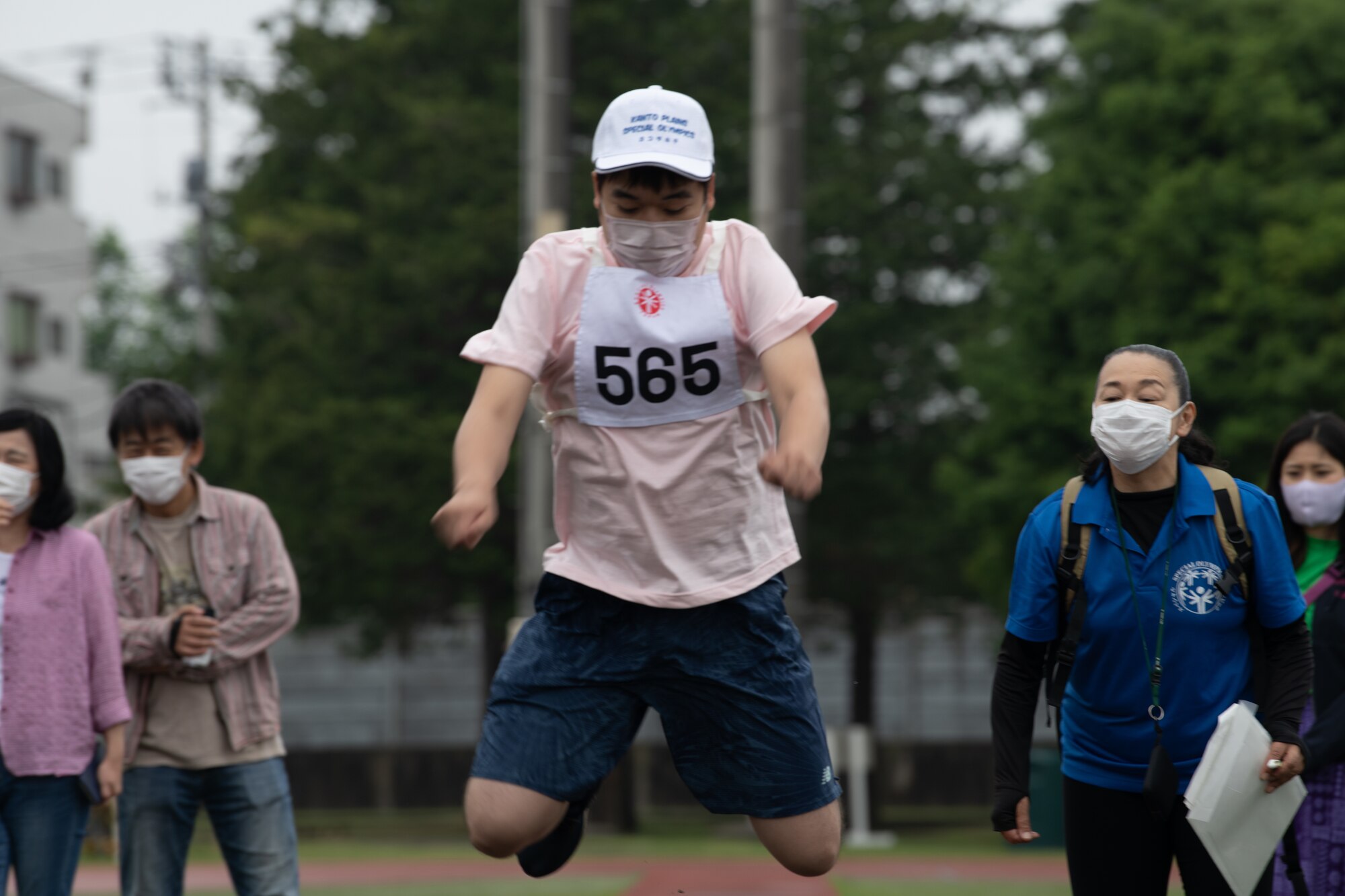 An athlete jumps during the Kanto Plains Special Olympics