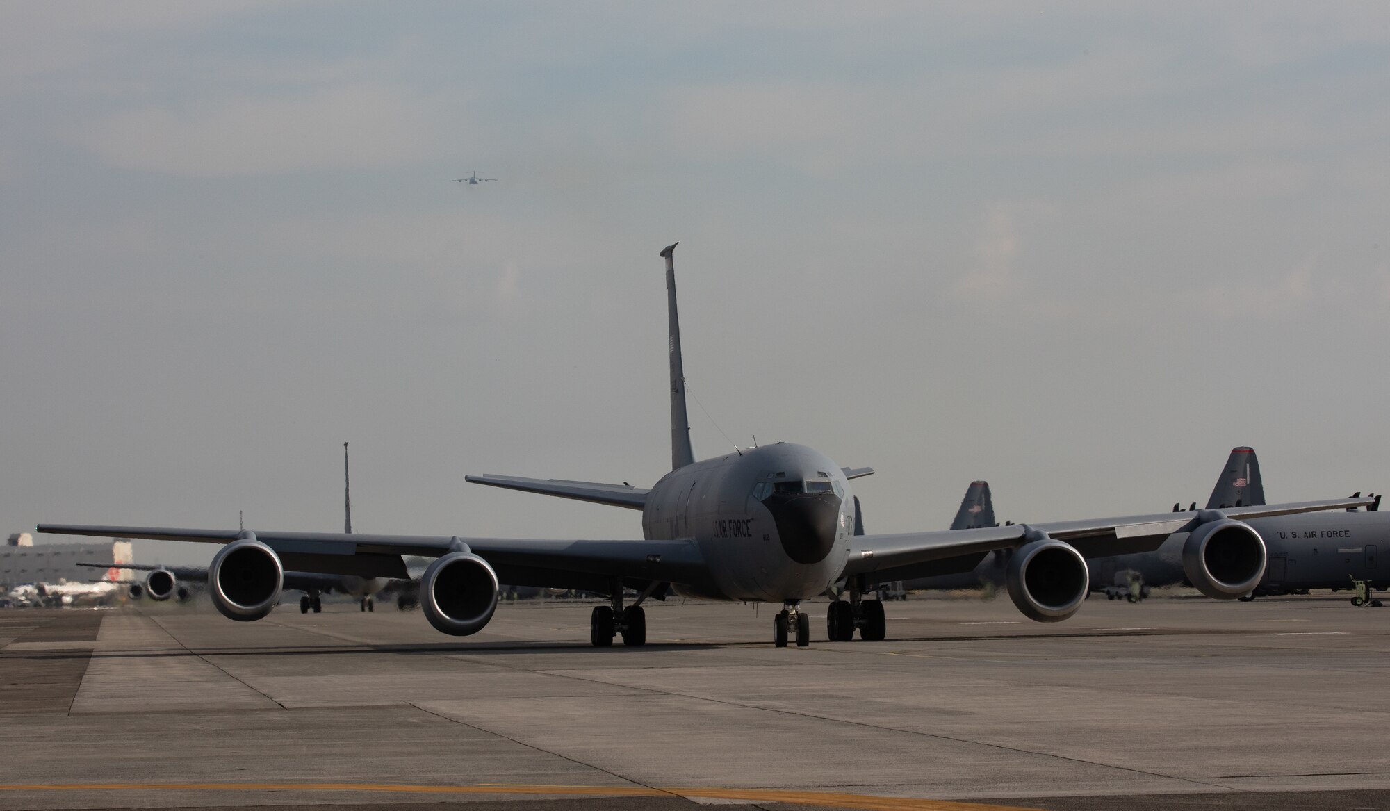 A KC-135 Stratotanker taxis down a flighline