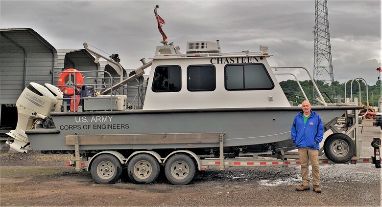 IN THE PHOTO, Mark Manning poses with the newly renamed survey vessel, the M/V Chasteen, named in honor of Darian Chasteen. Chasteen recently passed away, losing a hard-fought battle with cancer. While he is physically no longer with the district, his legacy will live on through stories and memories forever.