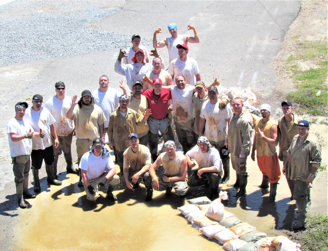 IN THE PHOTO, a recently passed Darian Chasteen pictured with the Soggy Bottom Boys while filling sandbags.