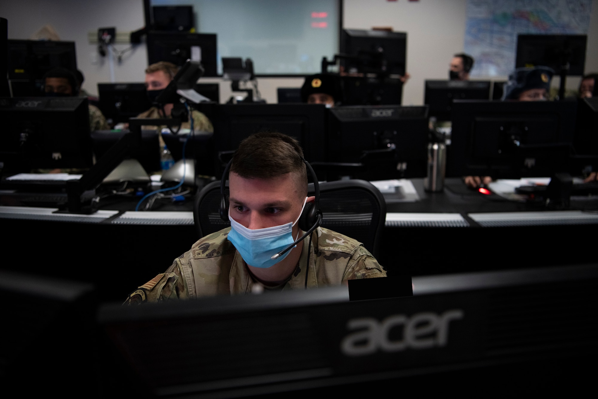 Man sitting behind a computer