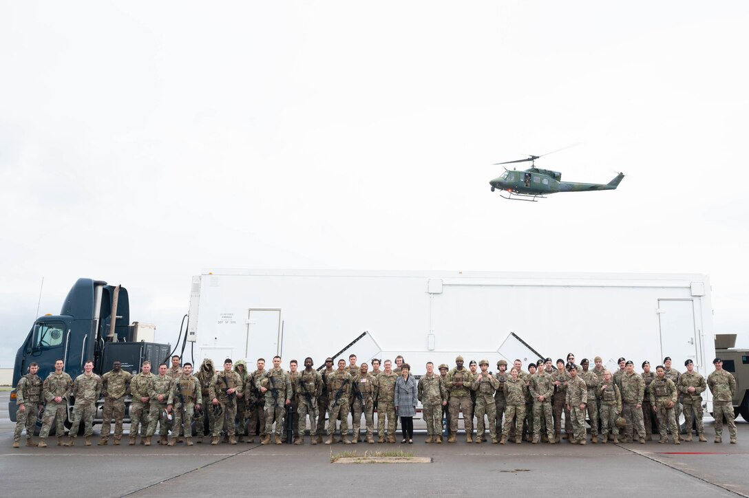 Gen. Tim Ray, Air Force Global Strike Command commander, his wife, Mrs. Rhonda Ray, and Chief Master Sgt. Charles Hoffman, AFGSC command chief, pose for a photo with members of the 341st Missile Security Operations Squadron May 25, 2021, at Malmstrom Air Force Base, Mont.