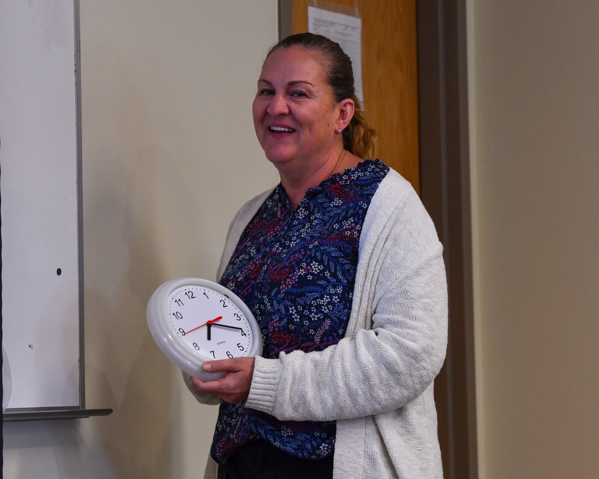 Danni Manyweathers, an expeditionary operations analysis for the Readiness Division under the Air Force Civil Engineering Center’s Modernization Section, changes the time on a clock to simulate an advancement of a tabletop exercise at Alpena Combat Readiness Training Center, Mich., May 22, 2021. The purpose of the tabletop exercise was to familiarize civil engineering Airmen with Rapid Airfield Deployment Recovery program and introduce them to scenarios from a leadership perspective during Exercise Mobility Guardian 2021. Mobility Guardian provides a realistic training environment for more than 1,800 Mobility Airmen to hone their skills in delivering rapid global mobility in current and future conflicts. (U.S. Air Force photo by Tech. Sgt. Kentavist P. Brackin)