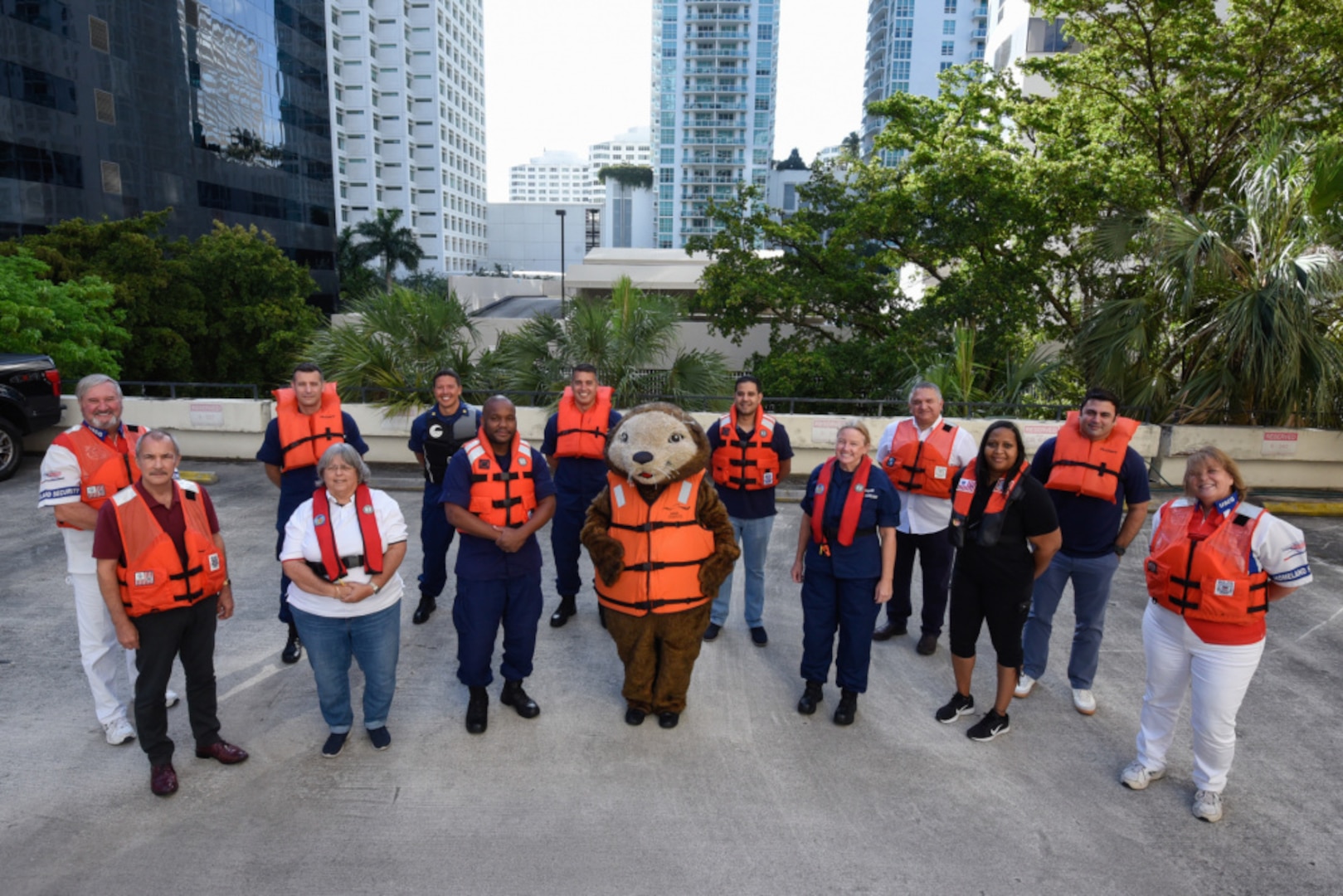 Members of the Coast Guard District Seven wear their life jackets in support of Wear Your Life Jacket at Work Day in Miami, Florida, May 21, 2021. This event marks the start of National Safe Boating Week which helps raise boating safety awareness. (U.S. Coast Guard photo by Petty Officer 3rd Class Jose Hernandez)