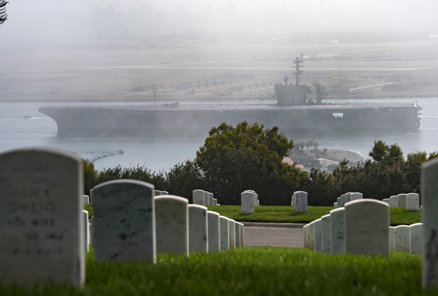 USS Theodore Roosevelt (CVN 71) passes Fort Rosecrans National Cemetery as it returns to Naval Air Station North Island.