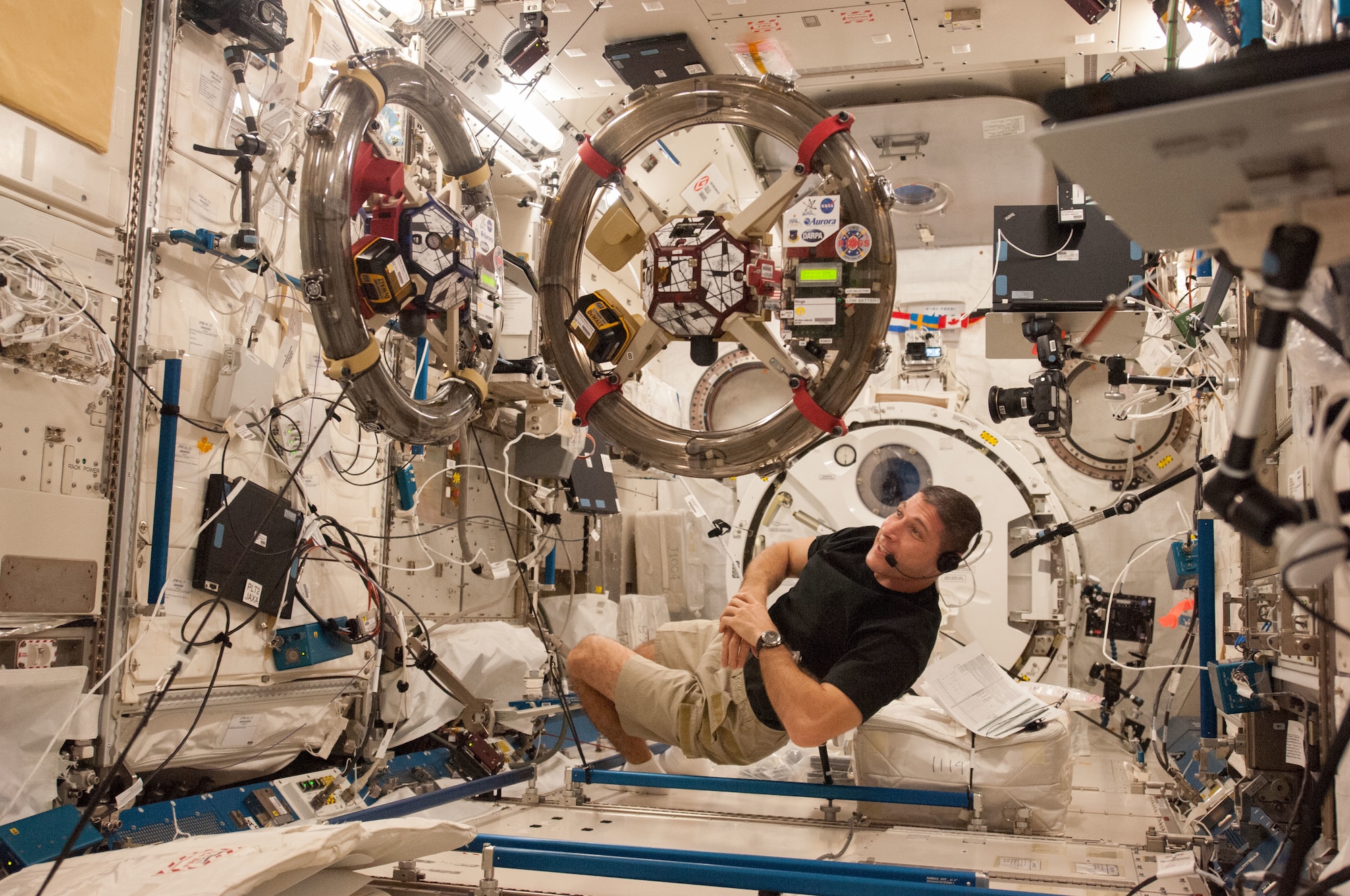 In the International Space Station’s Kibo laboratory, NASA astronaut Michael Hopkins, Expedition 37 flight engineer, conducts a session with a pair of bowling-ball-sized free-flying satellites known as Synchronized Position Hold, Engage, Reorient, Experimental Satellites, or SPHERES, November 4, 2013.