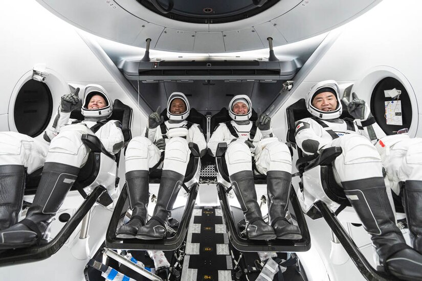NASA astronauts Shannon Walker, Victor Glover, Mike Hopkins, and JAXA astronaut Soichi Noguchi inside Crew Dragon spacecraft.