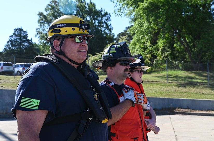 Firefighters from multiple agencies gather to take part in the Robert E. Rumens Marine Firefighting Symposium at Joint Base Langley-Eustis, Virginia, May 21, 2021. This training was a stepping stone for land firefighters to begin learning maritime firefighting and advance their skill sets. (U.S. Air Force photo by Senior Airman Sarah Dowe)