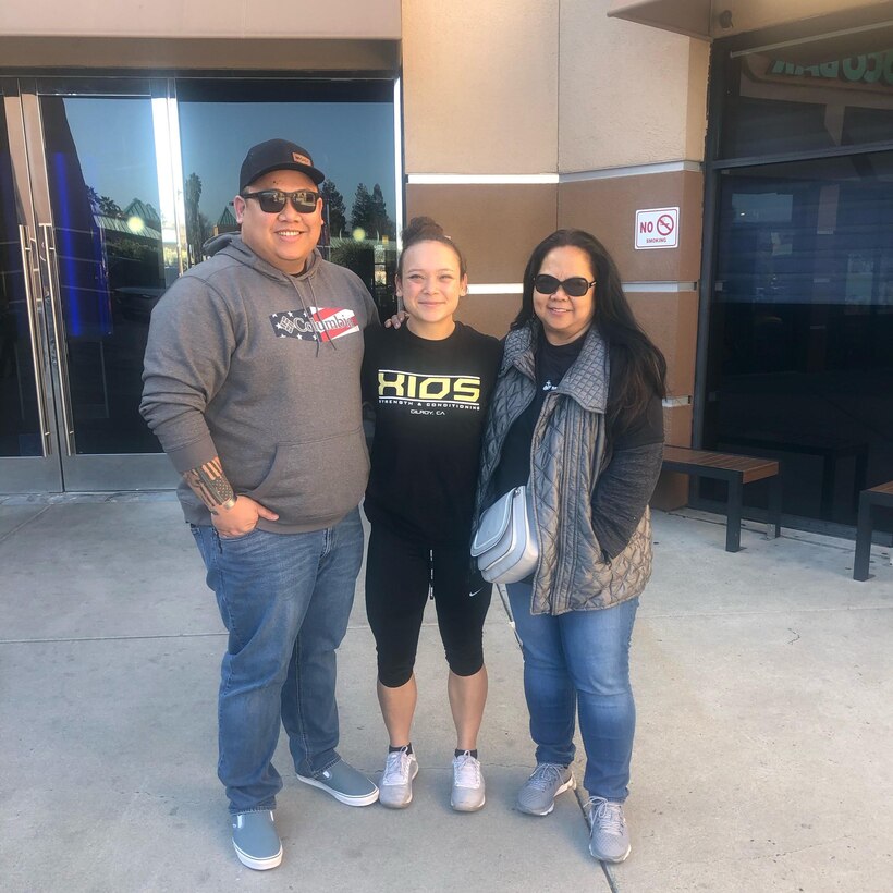 A family poses for a photo.