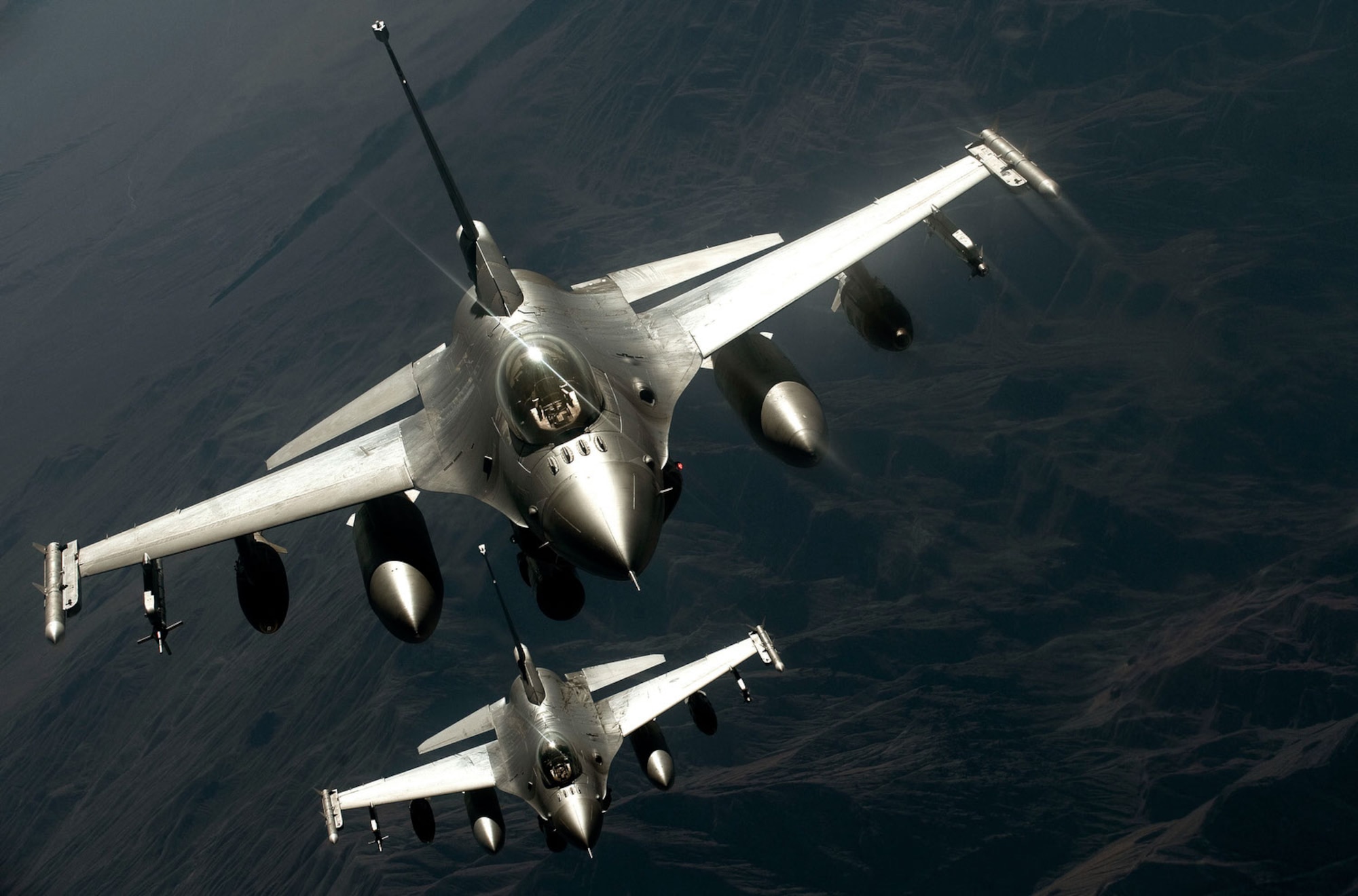 Two F-16 Fighting Falcons assigned to the Alabama Air National Guard's 187th Fighter Wing approach a tanker during an aerial refueling mission over Nevada during exercise Green Flag-West 13-02. (U.S. Air Force photo/Staff Sgt. Christopher Hubenthal)