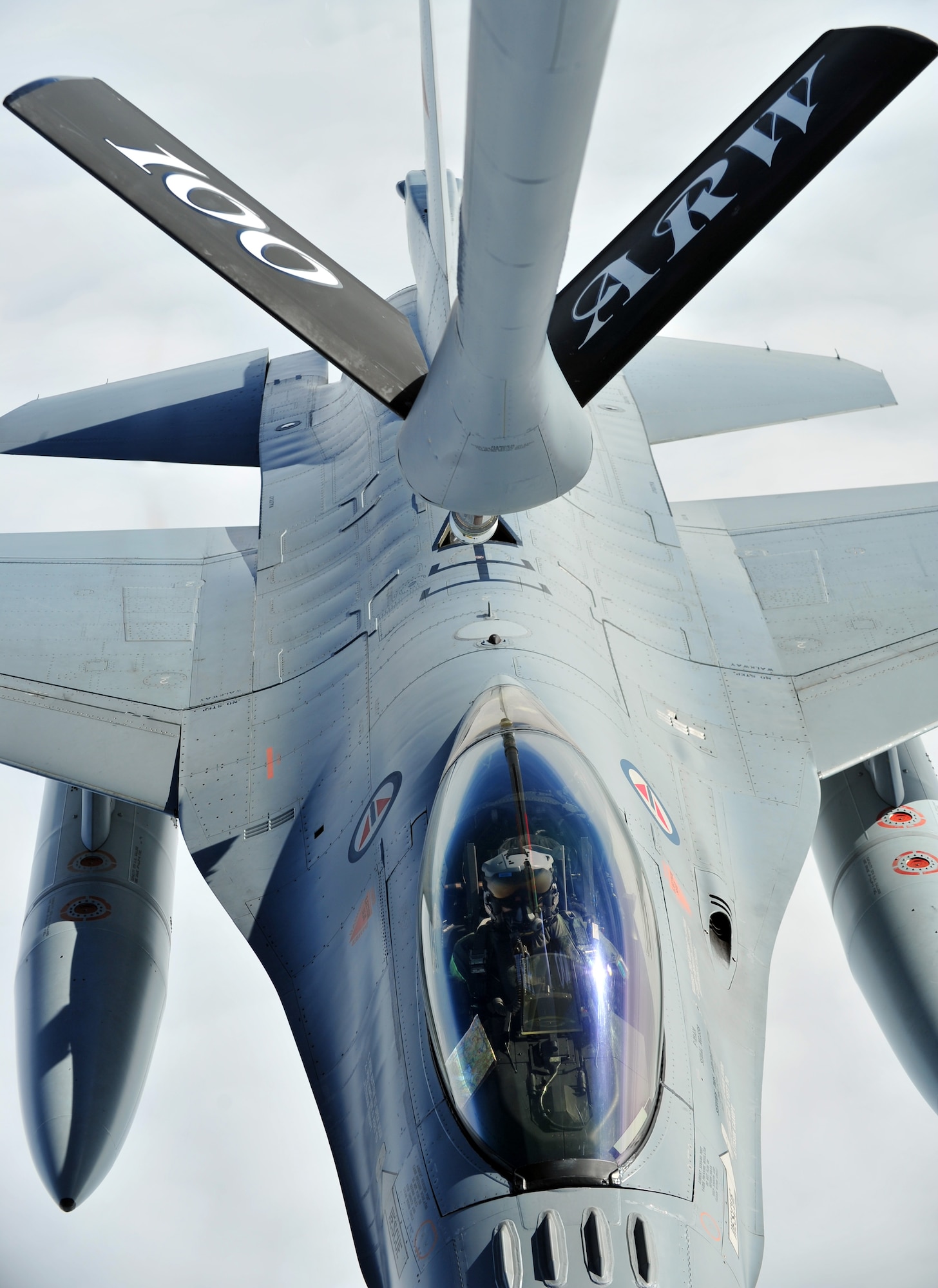 A Royal Norwegian Air Force F-16 Fighting Falcon prepares for a refuel from a KC-135 Stratotanker assigned to Royal Air Force Station Mildenhall, England, during a training sortie Sept. 5, 2014, over Norway. The KC-135 was part of a four-ship which enables tankers to provide concentrated aerial refueling support for large forces during major operations. (U.S. Air Force photo/Senior Airman Christine Griffiths)