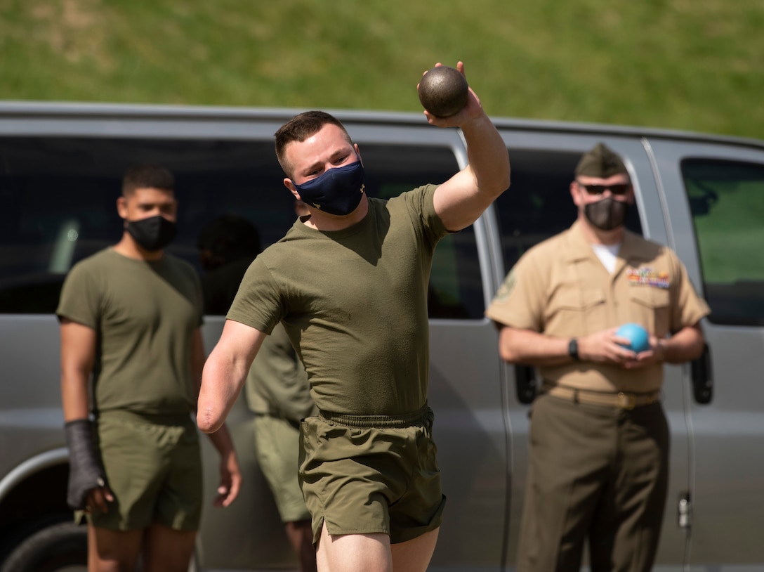 U.S. Marine throwing shot put.