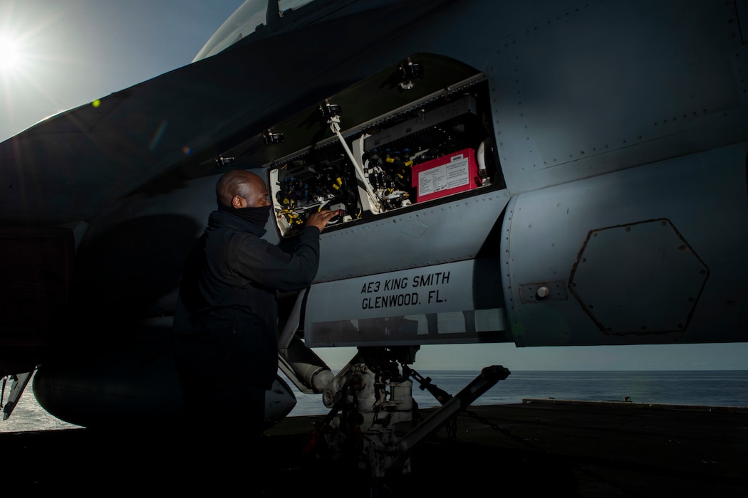 Aviation Electrician's Mate 3rd Class King Smith, from Glenwood, Florida, checks connectors for continuity on an F/A-18F Super Hornet, attached to the "Fighting Swordsmen" of Strike Fighter Squadron 32, aboard the Nimitz-class aircraft carrier USS Dwight D. Eisenhower (CVN 69).