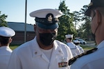 Chief Petty Officer Luis Brown, the Senior Enlisted Leader of 2nd Dental Battalion / NDC Cherry Point, inspects the Summer Dress White uniform of a Navy Officer on Thursday, May 20 aboard Marine Corps Air Station Cherry Point.