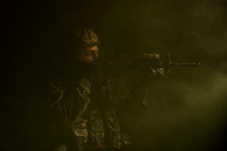 Airman 1st Class Kevin Cenci, 823rd Base Defense Squadron fire team member, looks out of a window during a training scenario, Moody Air Force Base, Jan. 12, 2018. The 823rd is one of three operational security forces squadrons under the 820th Base Defense Group whose mission is to provide high-risk force protection and integrated base defense for expeditionary forces. (U.S. Air Force photo by Bennie J. Davis III)