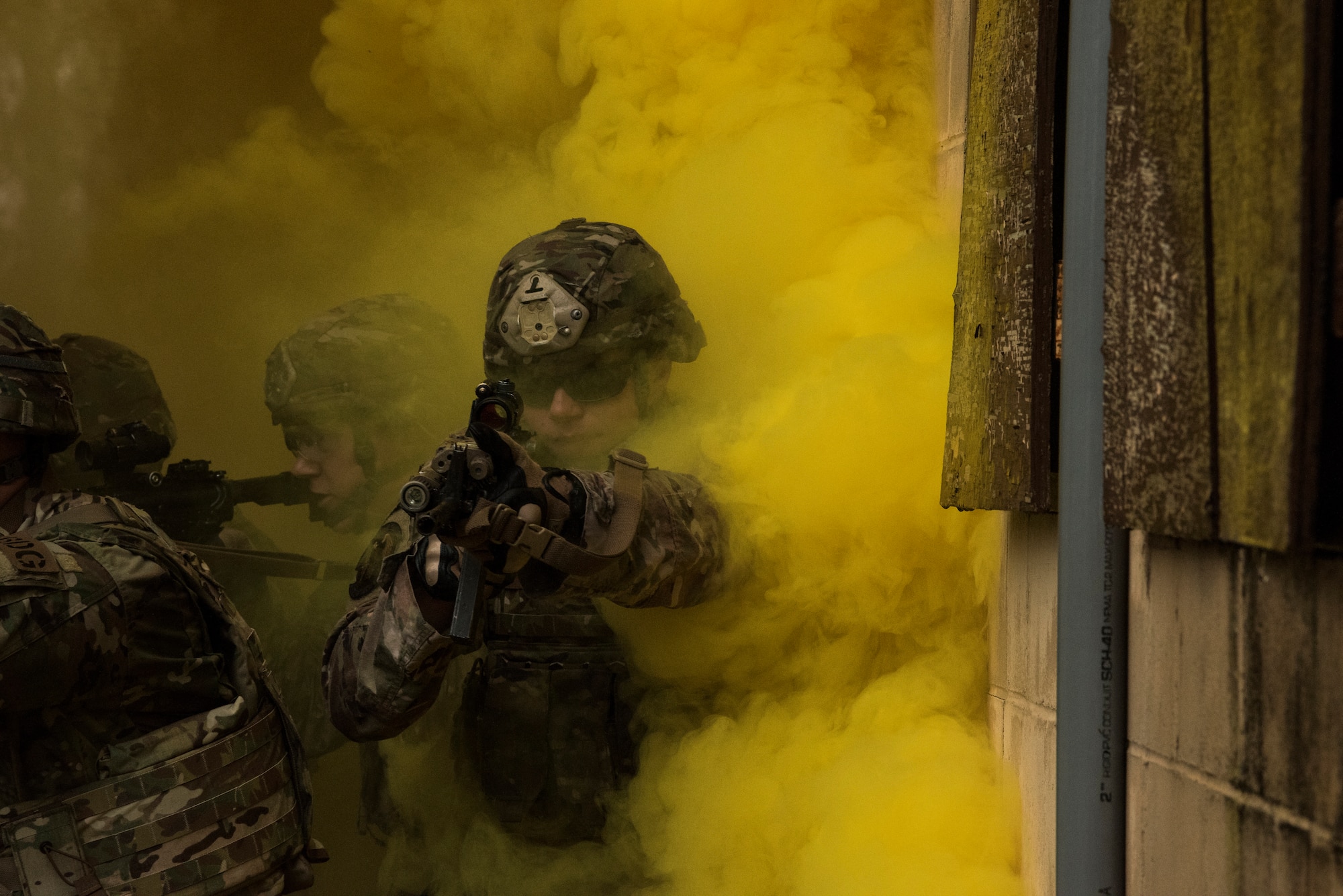 Airman 1st Class Kevin Cenci, 823rd Base Defense Squadron fire team member, moves through smoke as concealment from simulated enemy forces, Moody Air Force Base, Jan. 12, 2018. The 823rd is one of three operational security forces squadrons under the 820th Base Defense Group whose mission is to provide high-risk force protection and integrated base defense for expeditionary forces. (U.S. Air Force photo by Bennie J. Davis III)