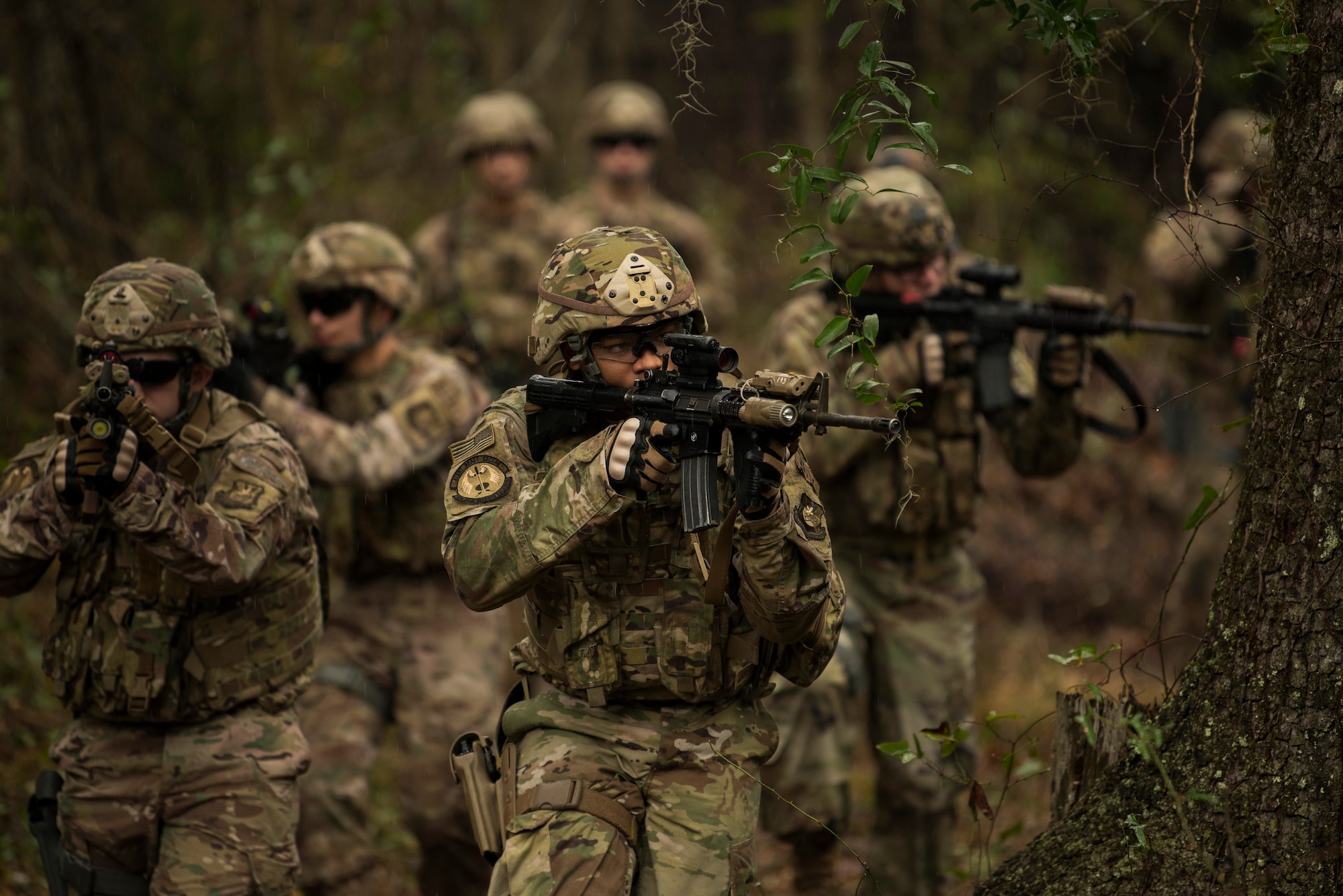 Members of the 823rd Base Defense Squadron move in formation while looking for enemy forces during a training scenario, Moody Air Force Base, Jan. 12, 2018. The 823rd is one of three operational security forces squadrons under the 820th Base Defense Group whose mission is to provide high-risk force protection and integrated base defense for expeditionary forces. (U.S. Air Force photo by Bennie J. Davis III)